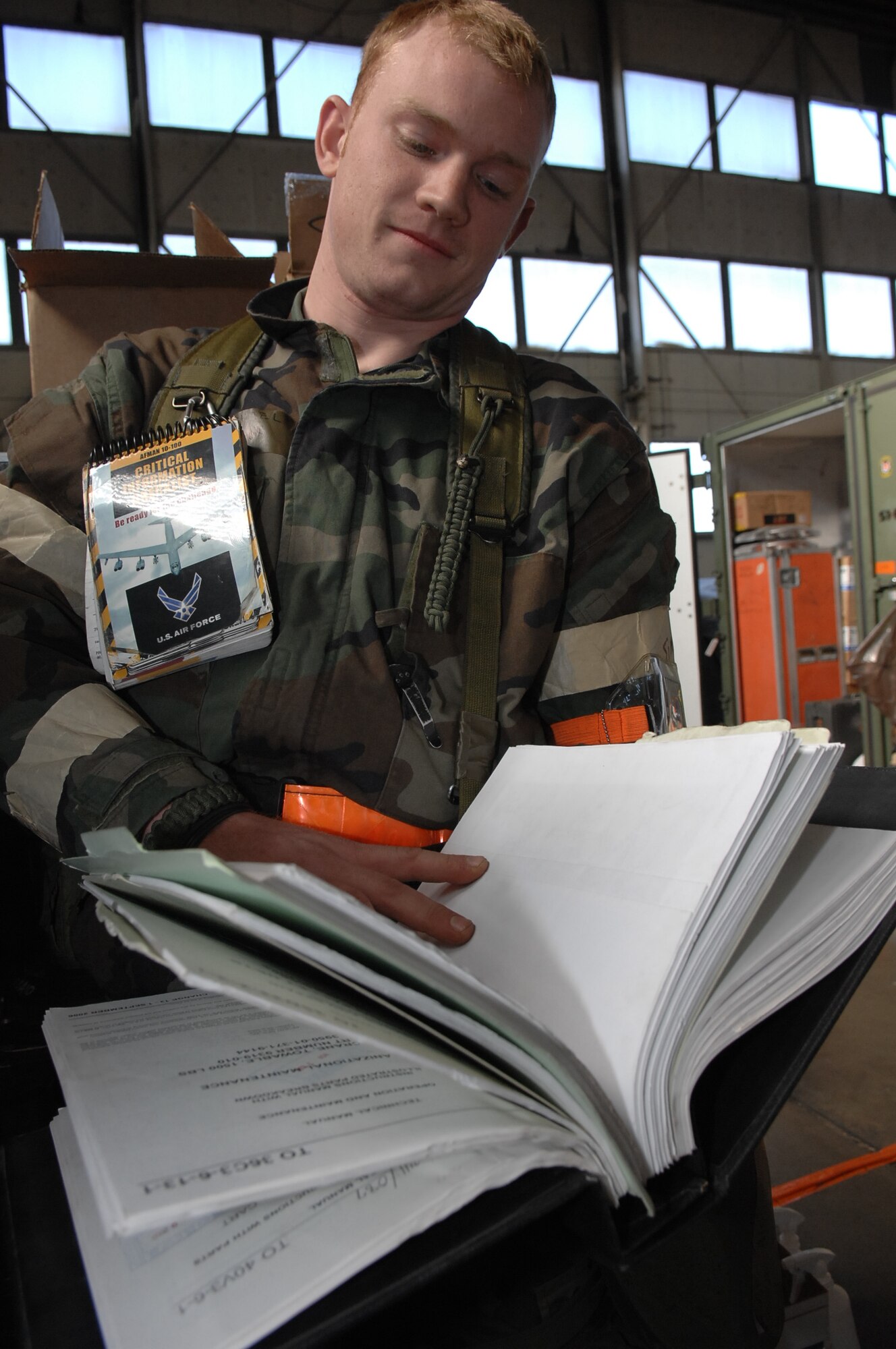 MOUNTAIN HOME AIR FORCE BASE, Idaho - Airman Michael Woessner, 391st Aircraft Maintenance Unit sortie support technician, reviews a technical order for an F-15E Strike Eagle during Exercise Sharpshooter 08-04.1 March 2. The F-15 has electronic systems and weaponry to detect, acquire, track and attack enemy aircraft while operating in friendly or enemy-controlled airspace.The 366th Fighter Wing conducts exercises to prepare personnel and equipment for the upcoming March 2008 Operational Readiness Inspection. (U.S. Air Force photo/ Staff Sgt. Kathy Parker)