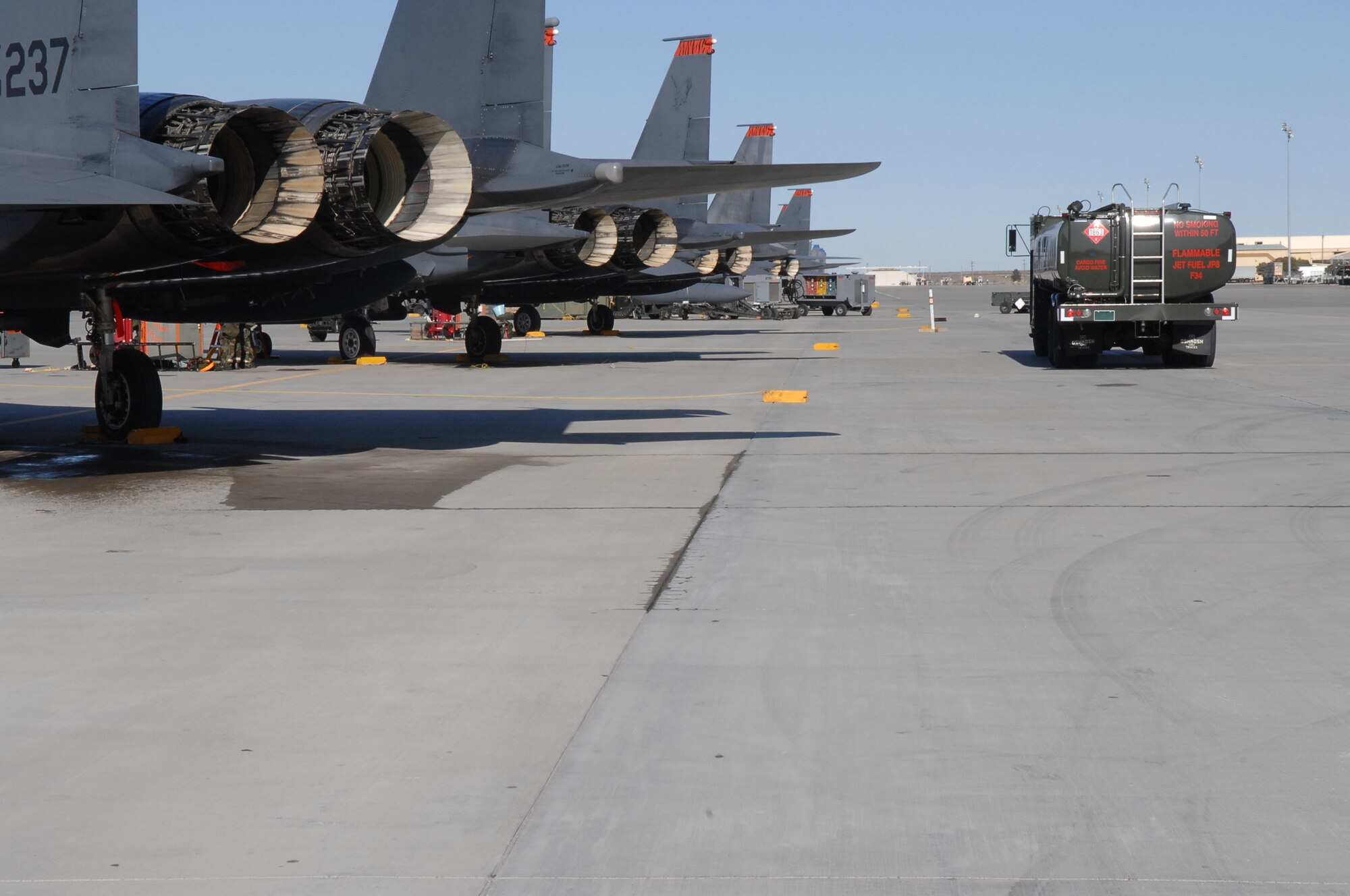 MOUNTAIN HOME AIR FORCE BASE, Idaho - Members of the 366th Logistics Readiness Squadron Petroleum Oil and Lubricants flight and 391st Fighter Squadron prepare F-15E Strike Eagles for take-off during aircraft regeneration as a part of Exercise Sharpshooter 08-04.1 March 2. The 366th Fighter Wing conducts exercises to prepare personnel and equipment for the upcoming March 2008 Operational Readiness Inspection. (U.S. Air Force photo/ Staff Sgt. Kathy Parker)