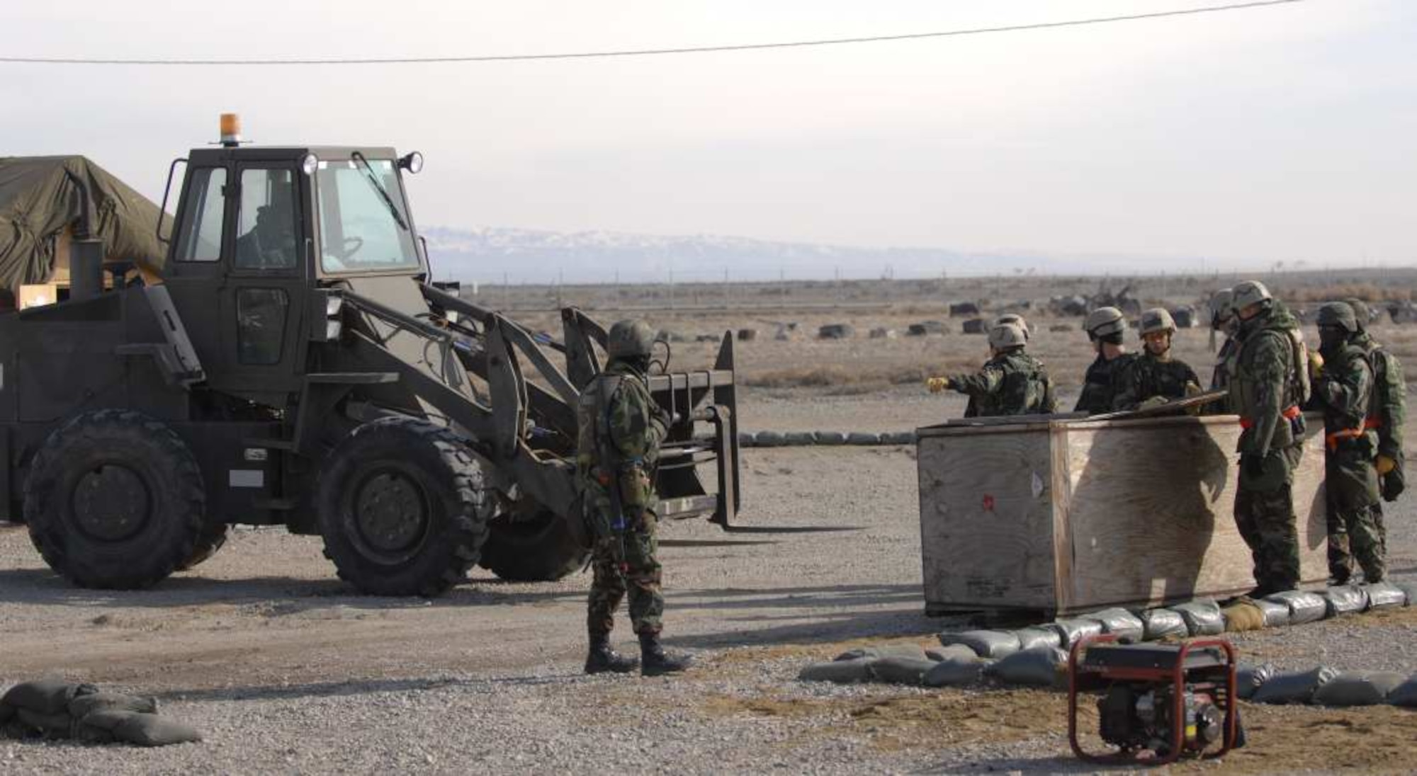 MOUNTAIN HOME AIR FORCE BASE, Idaho—Members from the 366th Civil Engineer Squadron collect materials to construct an Alaskan shelter at their simulated deployed location during Exercise Sharpshooter 08-04.1 Feb. 29. The 366th CES practices convoy operations to ensure they have the skills necessary to perform this duty when they deploy. The 366th Fighter Wing conducts exercises to prepare personnel and equipment for the upcoming March 2008 Operational Readiness Inspection. (U.S. Air Force photo/ Airman 1st Class Ryan Crane) 