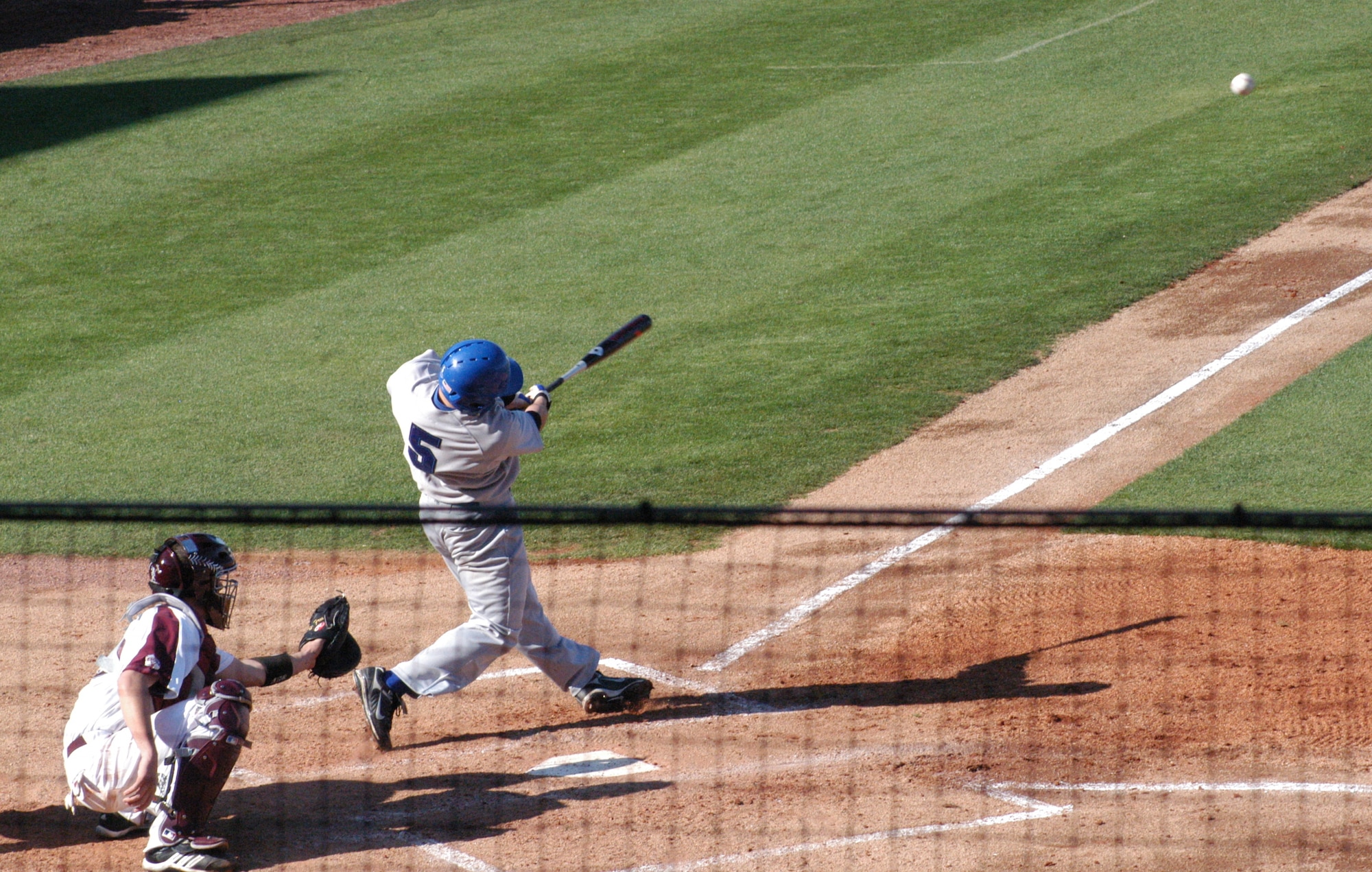 Falcons’ outfielder Chay Derbigny drives a ball into the outfield during the first game of a three set series in Starkville, Miss., against the Mississippi State University Bulldogs March 1. The U.S. Air Force Academy lost the series 1-2. (U.S. Air Force photo by Senior Airman John Parie)