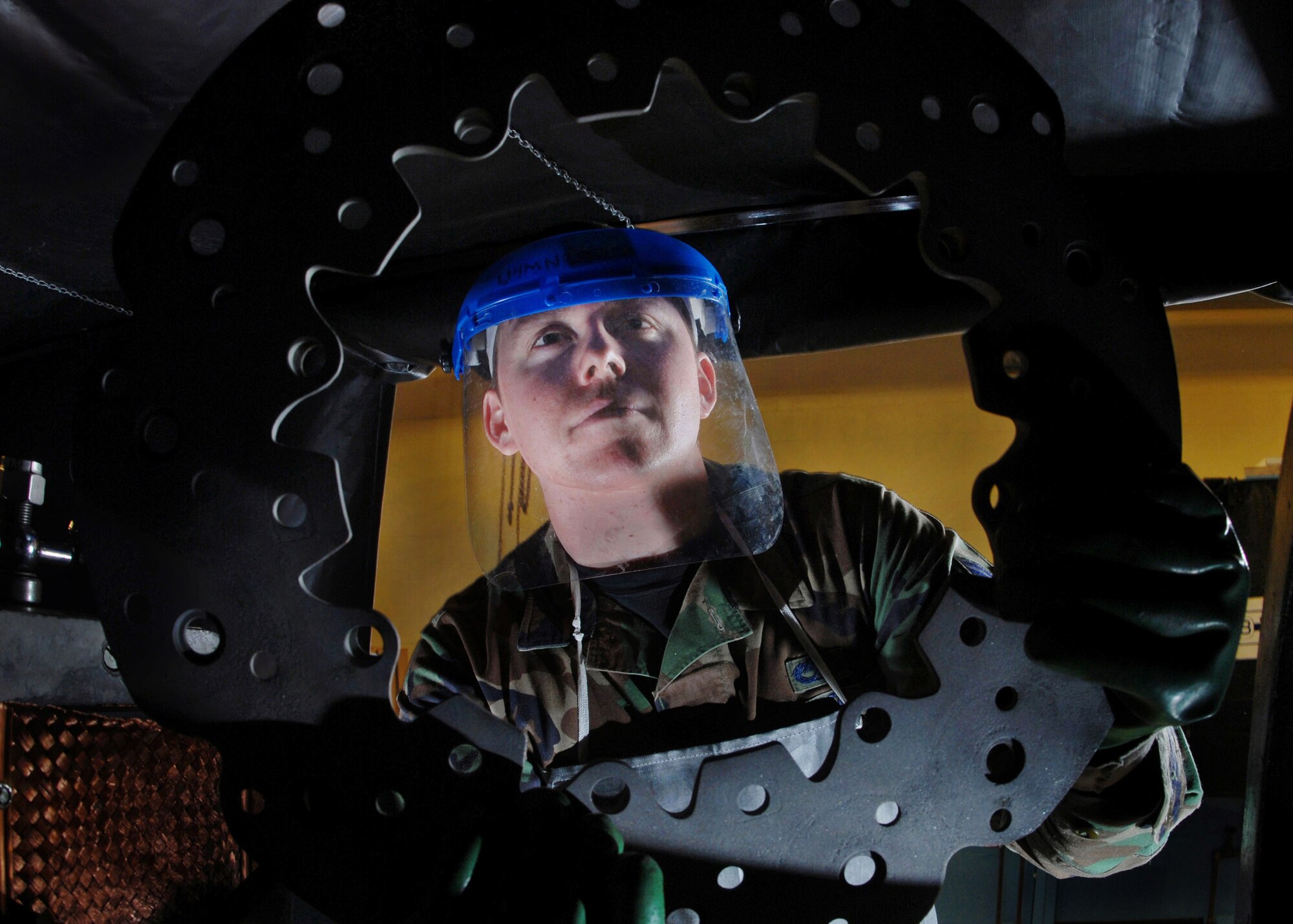 Senior Airman Jason Ray, a non-destructive inspection technician from the 452nd Maintenance Squadron, March Air Reserve Base, Calif., inspects a KC-135 Stratotanker refueling aircraft brake plate for fatigue and cracks.  He is checking the brake plate for fatigue and cracks. NDI technicians interpret and evaluate indications of test method applied to detect discontinuities and fl aws in aircraft, aerospace ground equipment, component parts, auxiliary equipment and pressurized and fl uid systems. (U.S. Air Force photo by Val Gempis)