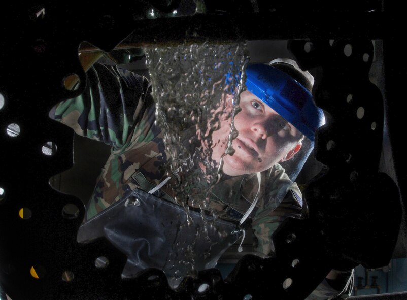 Senior Airman Jason Ray, a non-destructive inspection technician from the 452nd Maintenance Squadron, March Air Reserve Base, Calif., applies a magnetic particle bath to a KC-135 Stratotanker refueling aircraft brake plate during inspection on a magnetic particle machine. He is checking the brake plate for fatigue and cracks. NDI technicians interpret and evaluate indications of test method applied to detect discontinuities and flaws in aircraft, aerospace ground equipment, component parts, auxiliary equipment and pressurized and fl uid systems. (U.S. Air Force photo by Val Gempis)