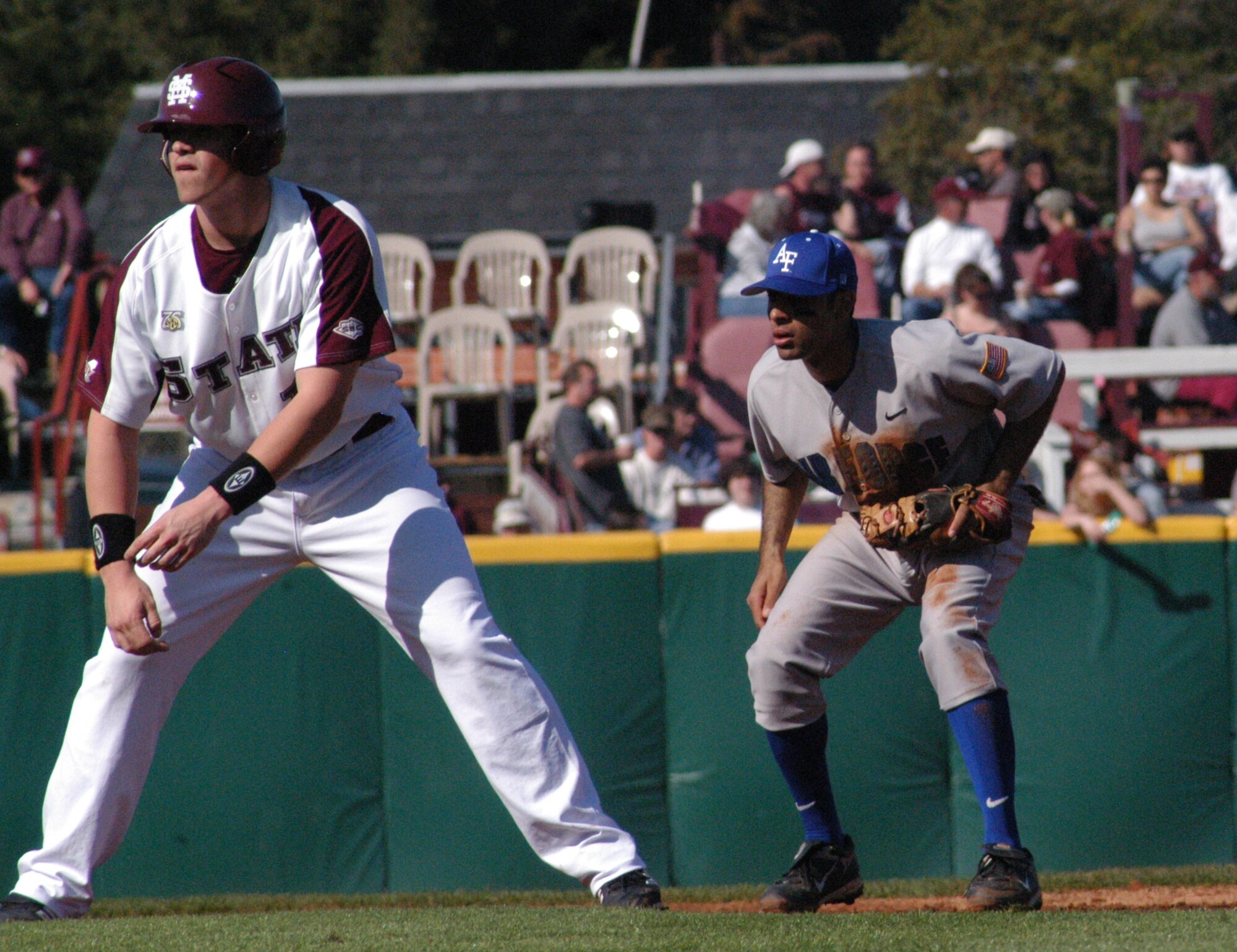 Falcons’ infielder K.J. Randhawa watches as Tyler Moore leads off during the first game of a three set series in Starkville, Miss., against the Mississippi State University Bulldogs March 1. The U.S. Air Force Academy lost the series 1-2. (U.S. Air Force photo by Senior Airman John Parie)