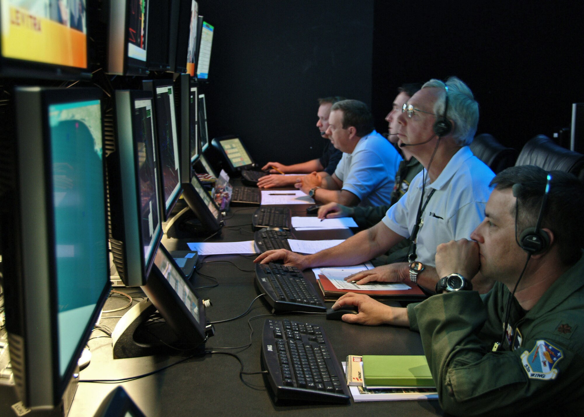Analysts and engineers monitor the B-1B tail warning function test Feb. 25 at the Central Control Facility at Eglin Air Force Base, Fla. The tail warning function is a radar that faces the rear of B-1B to detect incoming missiles or aircraft. If detected the system can deploy defensive countermeasures. (U.S. Air Force photo/Capt. Carrie Kessler) 
