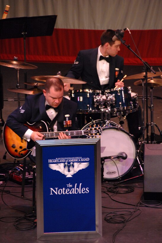 Senior Airman Ryan Manzi, guitar, and Airman First Class Steve Helfand, drums, lay down a solid jazz groove for The Noteables during their February 17th performance at Iowa Western Community College.