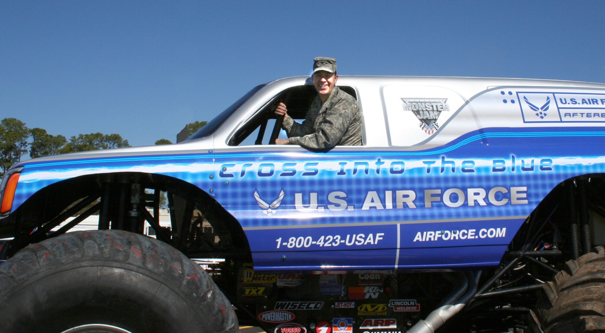 Col. Greg Touhill, 81st Training Wing commander, gets behind the wheel of the Air Force's monster truck before the opening of the new base service station complex Feb. 7.  The Air Force monster truck was in the area for a show at the Mississippi Coast Coliseum in Biloxi.  (Courtesy photo)
