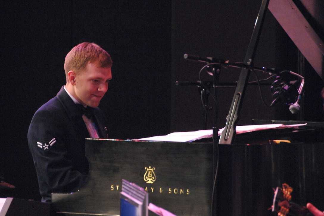 Airman First Class Mike Srstka, pianist, with the USAF Heartland of America Band's Noteables jazz ensemble wows the audience with his improvisation abilities during a jazz arrangement of "Bye Bye Blackbird."