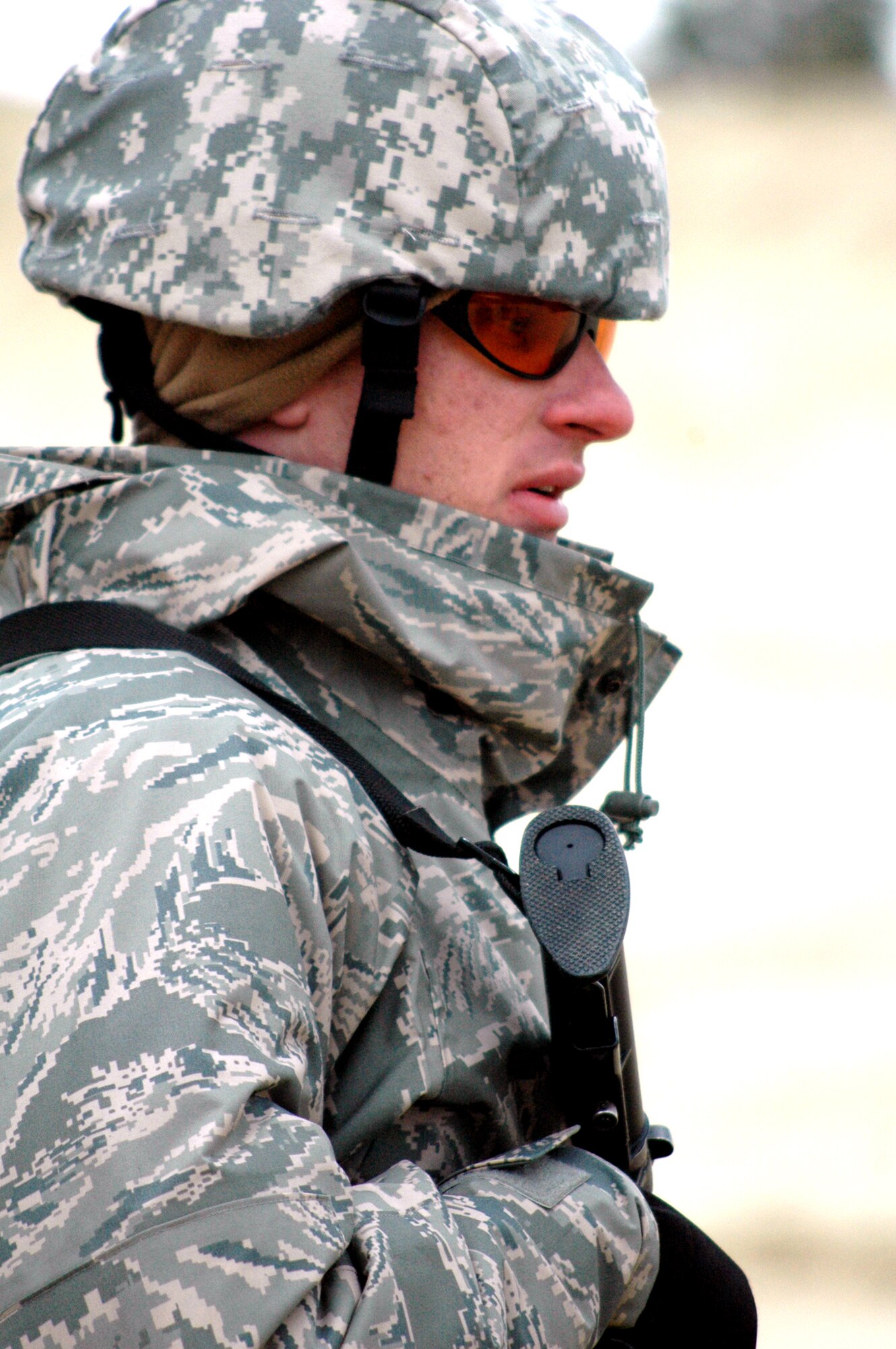 Tech. Sgt. Travis Gayou waits for his next instructions to shoot during tactical live fire training with an M-4 and M-9 on a range on Fort Dix, N.J., Feb. 27, 2008, as part of training in the Air Advisor Course 08-1.  The course is taught by the U.S. Air Force Expeditionary Center's Expeditionary Operations School and guest instructors preparing Airmen for their roles in training forces in Afghanistan and Iraq.  Sergeant Gayou is from the 320th Training Squadron, Lackland Air Force Base, Texas.  (U.S. Air Force Photo/Tech. Sgt. Scott T. Sturkol)