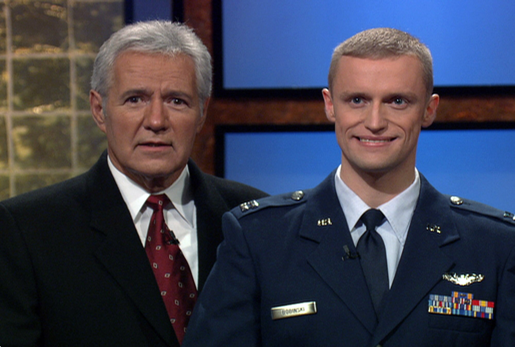 "Jeopardy!" host Alex Trebek and Capt. Timothy Bobinski pose on the set of the show. Captain Bobinski was a contestant on the show in November, and the episode is due to air March 6. Captain Bobinski is the 19th Fighter Squadron chief of safety at Elmendorf Air Force Base, Alaska. (Courtesy photo)
