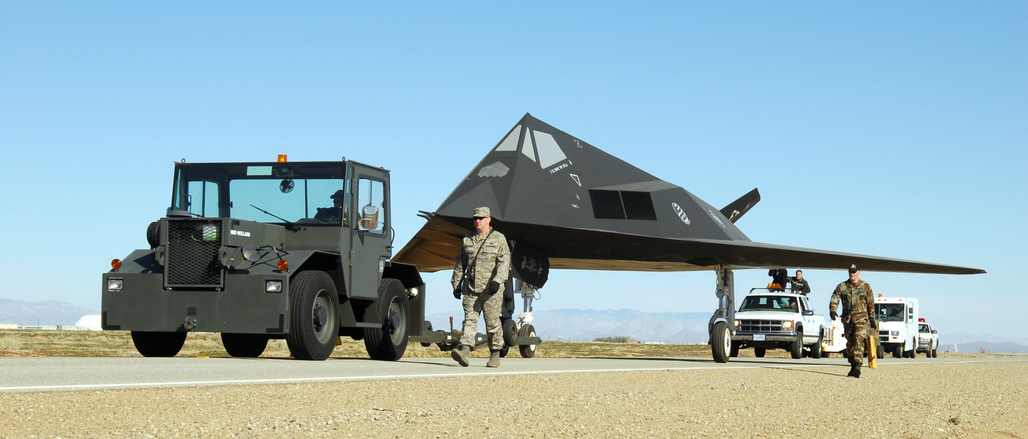 PALMDALE, Calif. -- Volunteers with the 410th Flight Test Squadron here move an F-117 Nighthawk to the Blackbird Air Park at U.S. Air Force Plant 42 here March 3. The F-117 was decommissioned and transferred to the National Museum of the U.S. Air Force. (Air Force photo by Senior Airman Julius Delos Reyes)