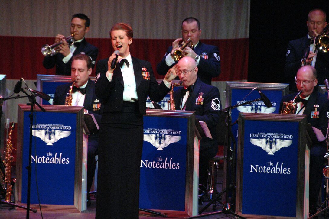 Staff Sgt. Krista Joyce fronts The Noteables jazz ensemble in a rousing big band tune.  This concert at Iowa Western Community College was part of the group's February local tour.