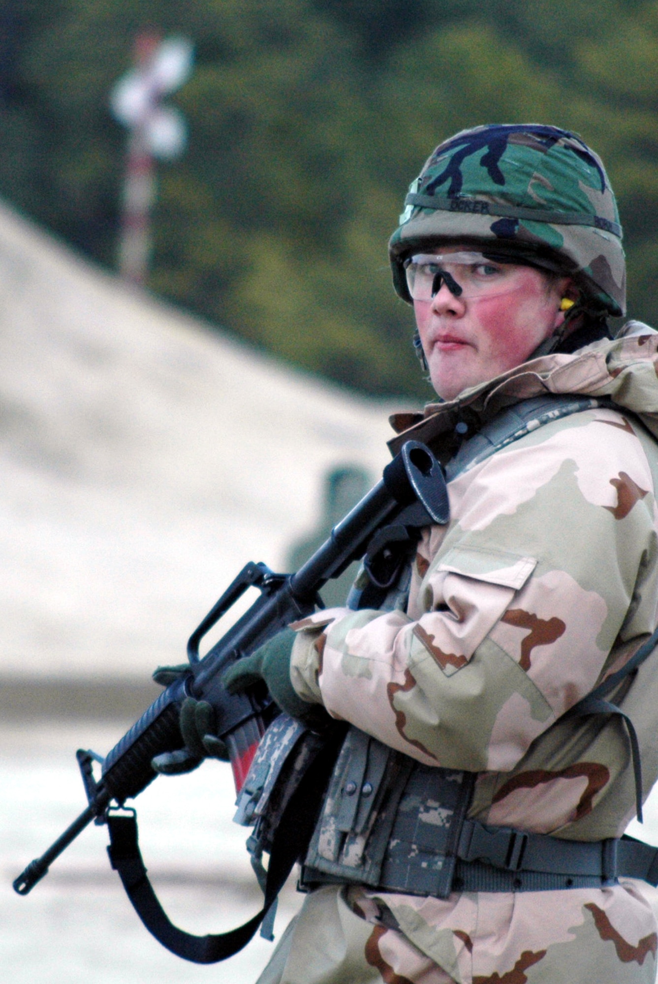 Staff Sgt. Johnathon Ocker waits for his next instructions to shoot during tactical live fire training with an M-4 and M-9 on a range on Fort Dix, N.J., Feb. 27, 2008, during training in the Air Advisor Course 08-1.  The course is taught by the U.S. Air Force Expeditionary Center's Expeditionary Operations School.  Sergeant Ocker is from the 5th Maintenance Squadron, Minot Air Force Base, N.D.  (U.S. Air Force Photo/Tech. Sgt. Scott T. Sturkol)