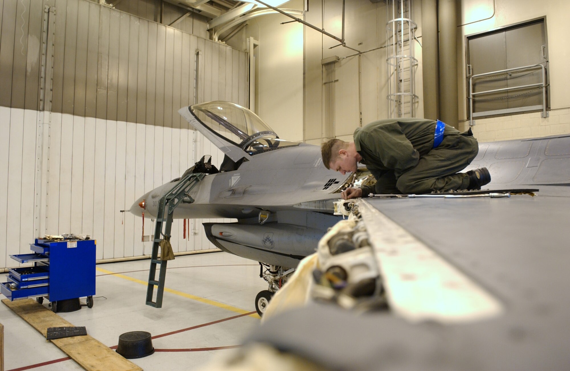 Staff Sgt. Robert McNiven replaces a leading edge flap rotary actuator on an F-16 Fighting Falcon Feb. 28 at Eielson Air Force Base, Alaska. The flap enables F-16 maneuverability while in flight. After receiving the aircraft from Kunsan Air Base, Korea, Airmen of the 345th Aircraft Maintenance Squadron perform an inspection and replace parts that are worn or may cause future problems. Sergeant McNiven is a crew chief with the 354th AMXS. (U.S. Air Force Photo/Airman 1st Class Jonathan Snyder)