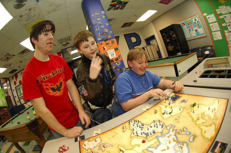 MOODY AIR FORCE BASE, Ga. -- Michael Brunelle, Matthew Monigold, and Michael Jasinski enjoy a game of Mission Risk during the Battle Club at the Youth Center here Feb 28. The club started out as a chess club and has since expanded in to club that competes in a championship of numerous different board games. (U.S. Air Force photo by Senior Airman Elizabeth Rissmiller)
