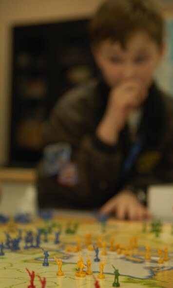 MOODY AIR FORCE BASE, Ga. -- Matthew Monigold contemplates his next move in a game of Mission Risk during the “Battle Club” at the youth center here Feb 28. The Battle Club teaches strategy, tactics and face-to-face social skills. (U.S. Air Force photo by Senior Airman Elizabeth Rissmiller)