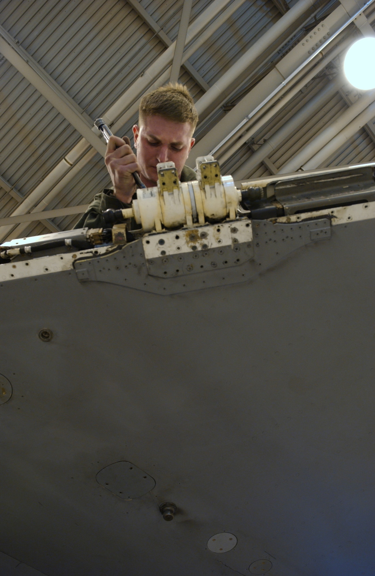 Staff Sgt. Robert McNiven finishes attaching a leading edge flap rotary actuator on an F-16 Fighting Falcon Feb. 28 at Eielson Air Force Base, Alaska. The flap enables F-16 maneuverability while in flight. After receiving the aircraft from Kunsan Air Base, Korea, Airmen of the 345th Aircraft Maintenance Squadron perform an inspection and replace parts that are worn or may cause future problems. Sergeant McNiven is a crew chief with the 354th AMXS. (U.S. Air Force Photo/Airman 1st Class Jonathan Snyder)