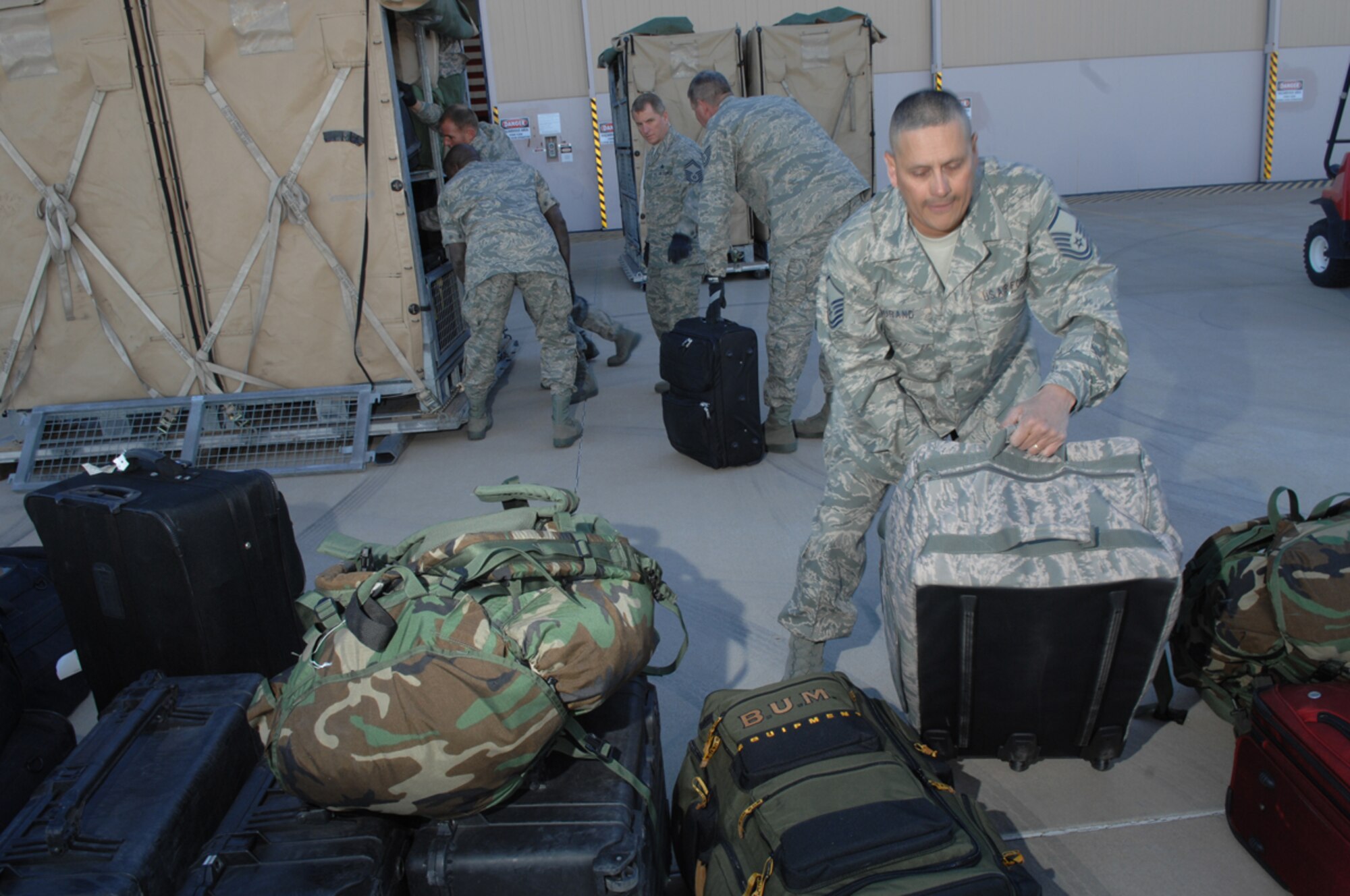Master Sgt. Victor Durand, 943rd Rescue Group, gathers equipment to prepare for a deployment Feb. 28 at Davis-Monthan AFB. The 943rd is an Air Force Reserve unit located here, and is assigned to the 920th Rescue Wing at Patrick AFB Fla. The 943 RQG trains personnel with equipment, to achieve and maintain the capability to perform day/night combat rescue missions. (U.S. Air Force photo by Senior Airman Christina D. Kinsey)

