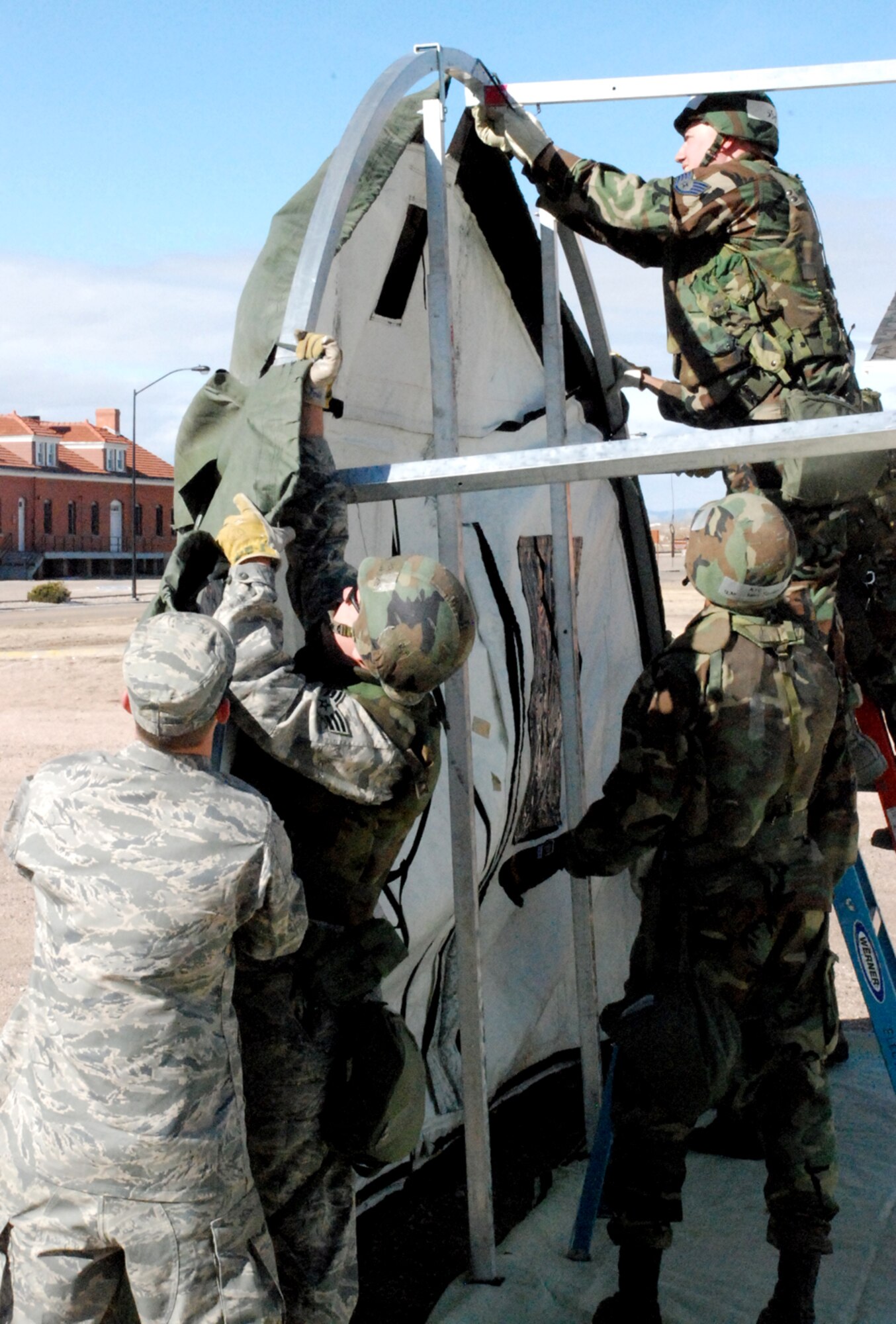 Several 90th CES Airmen practice erecting an Alaskan tent during the exercise. The readiness flight schedules job-specific training for the squadron to practice what would occur in a deployed environment.