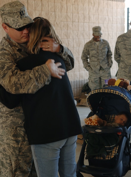 MOODY AIR FORCE BASE, Ga – Captain Garrett Keaough, 41st Rescue Squadron HH-60G Pave Hawk pilot, hugs his wife goodbye here Feb. 29. Capt. Keaough is deploying with the 41st RQS in support of Operation Iraqi Freedom. (U.S. Air Force photo by Senior Airman Schelli Jones) 