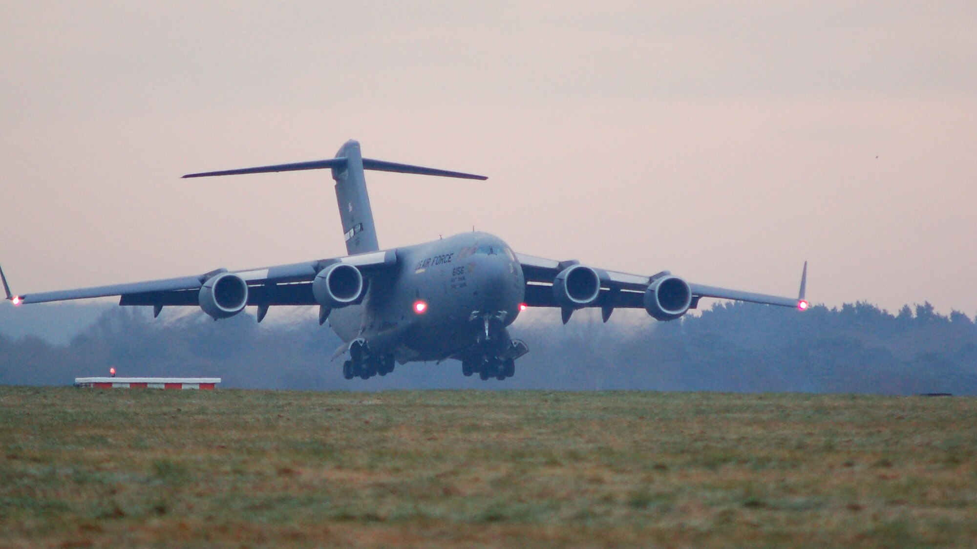 A C-17 Globemaster III from Travis Air Force Base, Calif., touches down Feb. 28 at RAF Mildenhall.  The jet ferried Airmen of the 817th Expeditionary Airlift Squadron to their new deployed home here.  The unit typically performs heavy airlift operations from Incirlik Air Base, Turkey, but has relocated to Mildenhall due to extensive renovation on the 10,000 foot runway there.  (U.S. Air Force photo by Tech. Sgt. Eric Petosky)