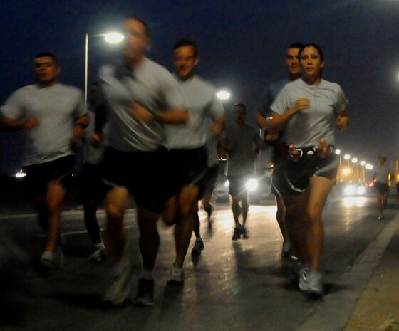 1st Lt. Jessica Lopez (far right) begins a marathon with a group of fellow Air Force runners March 2 in Southwest Asia. The wing organized a 5k race for members to compete in and support the lieutenant, who was running at the same time as her mother, Dawn, who was running in the L.A. Marathon. (U.S. Air Force photo/Senior Airman Domonique Simmons) 