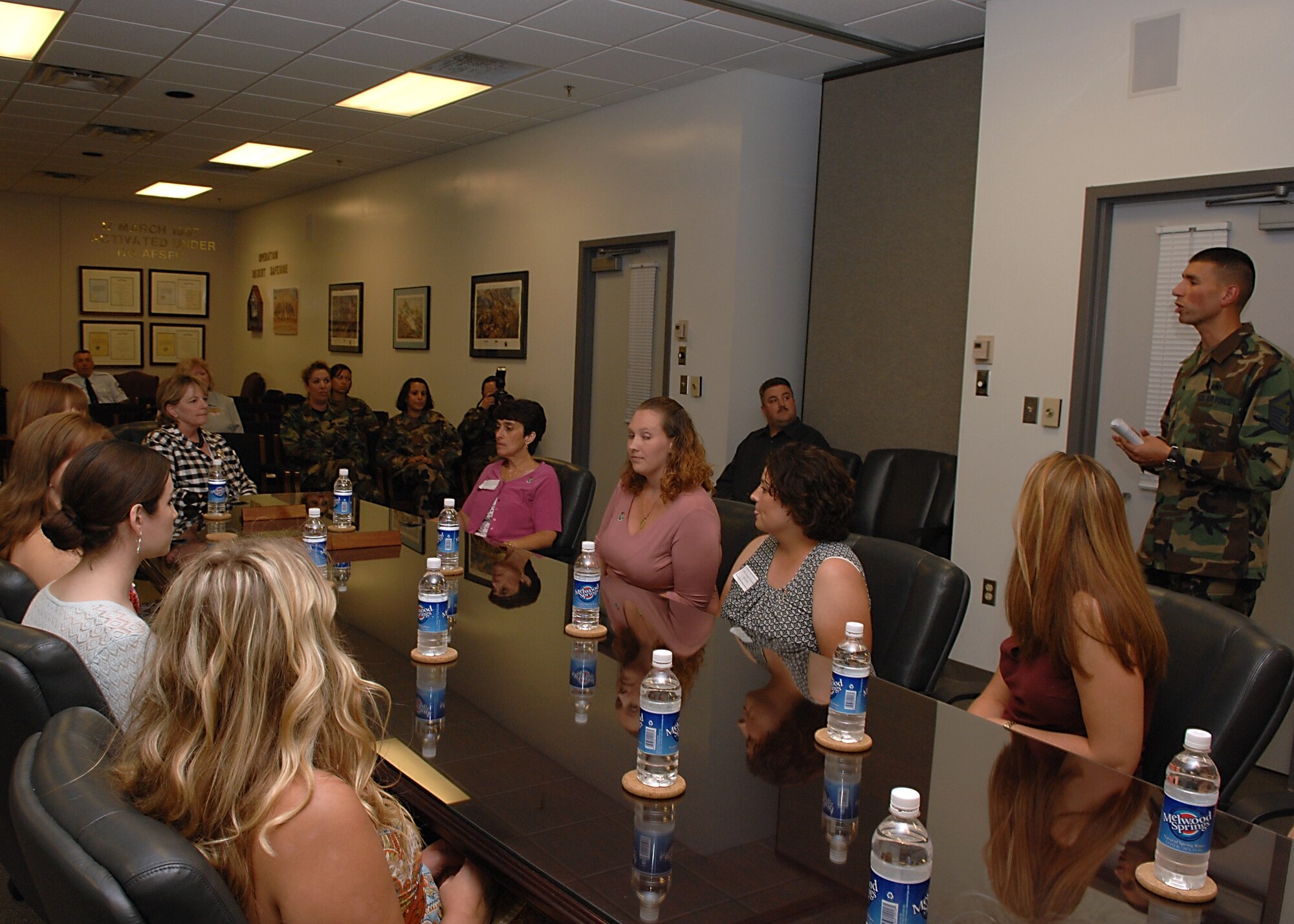 MOODY AIR FORCE BASE, Ga. -- Master Sgt. Michael Dias, 822nd Security Forces Group first sergeant, briefs Jennie Mosley, wife of Air Force Chief of Staff Gen. T. Michael Mosley, and members of the 820th SFG deployed spouses group here Jun. 22. The Family and Loved ones Appreciation and Information Committee gives spouses a myriad of information concerning deployments. (U.S. Air Force photo by Airman 1st Class Brittany Barker)