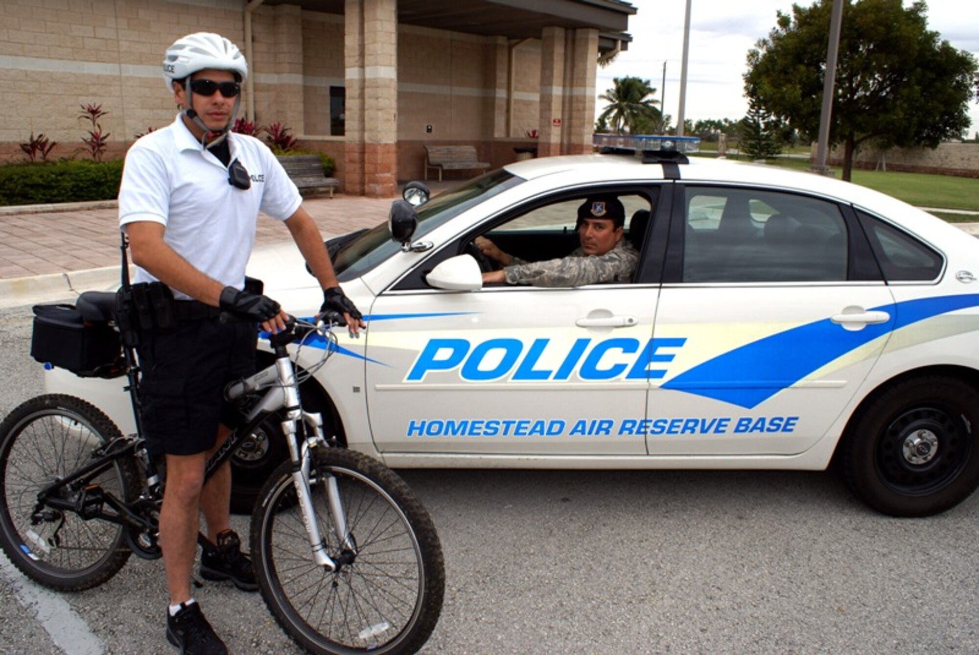 The 482nd Security Forces Squadron recently added new patrol car to its fleet, and the squadron is testing a bicycle patrol program currently pending approval from Air Force Reserve Command Headquarters. Tech. Sgt. Rickie Cancel (left) and Master Sgt. John Frank (right), 482nd Security Forces members, both completed the bicycle patrol certification course and regularly patrol Homestead Air Reserve Base in the new vehicle. (U.S. Air Force photo/Senior Airman Erik Hofmeyer)