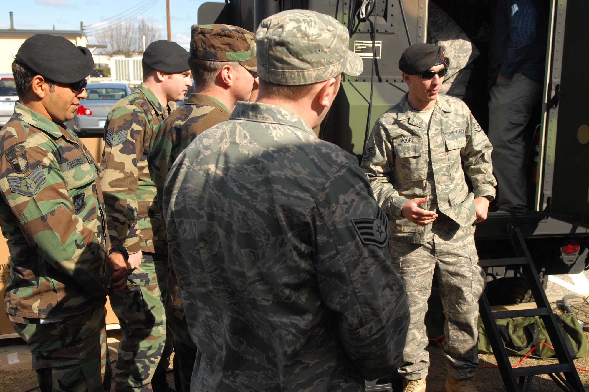 SHAW AIR FORCE BASE, S.C. -- Staff Sgt. Andrew Moore describes how the communications systems transmit information on the Air Support Operations Center Gateway vehicle Feb. 27. Tactical air controllers from all over the Air Force are here to attend a one week training course on this new vehicle in preparation for deployment. (U.S. Air Force photo/Staff Sgt. Henry Hoegen.)
