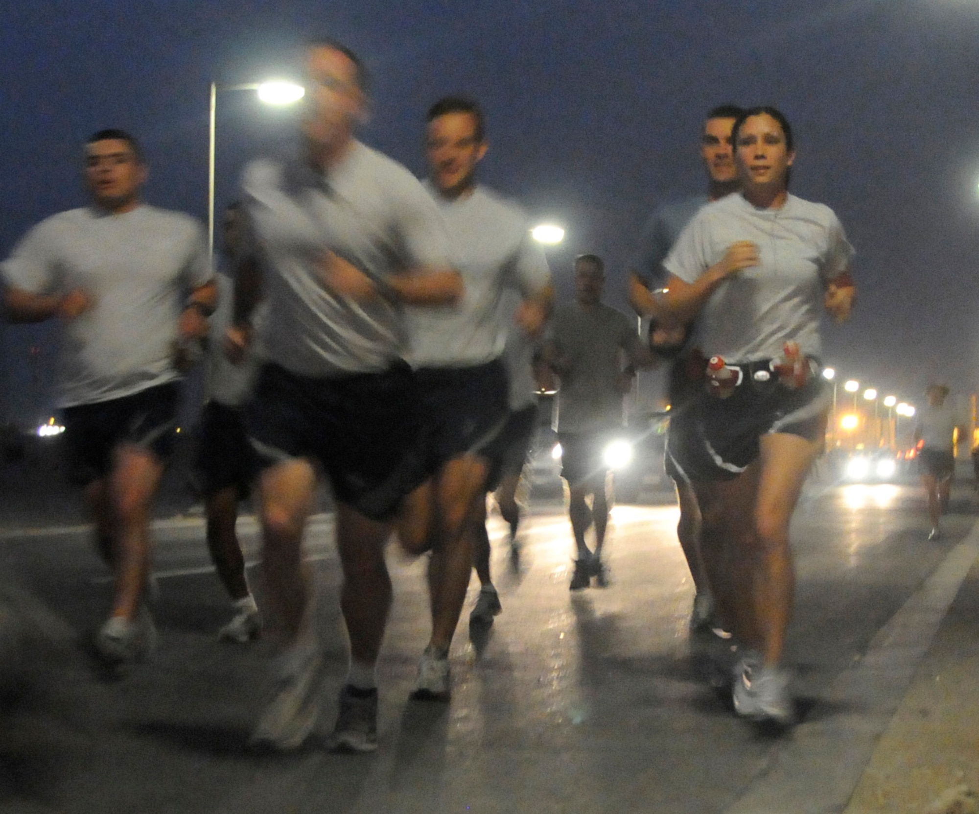 SOUTHWEST ASIA -- 1st Lt. Jessica Lopez, far right, begins a marathon with a group of fellow Air Force runners here March 2. In conjunction with her marathon, the wing organized a 5k race for members to compete in and support the C-17A pilot, who was running at the same time as her mother, Dawn, was running the L.A. Marathon. (U.S. Air Force photo/Senior Airman Domonique Simmons)