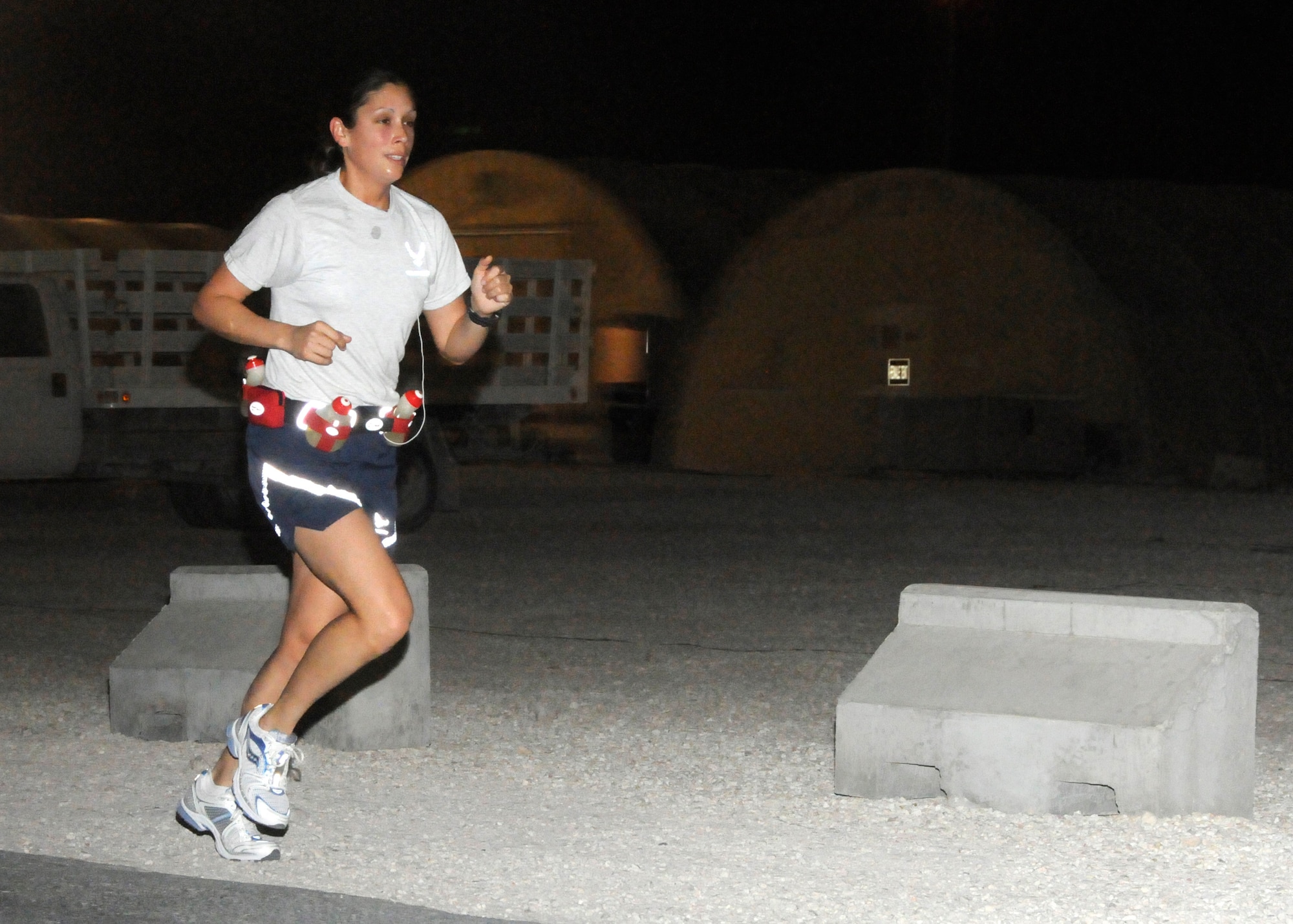 SOUTHWEST ASIA -- 1st Lt. Jessica Lopez runs the first 3 miles of her 26.2-mile marathon on base March 2. The C-17A pilot from Charleston Air Force Base, S.C., was training to run the L.A. Marathon with her mother, Dawn, when she got deployment orders. The pair decided to run at the same time anyway, mother in California and daughter in the desert. Lieutenant Lopez finished in 3:39. (U.S. Air Force photo/Senior Airman Domonique Simmons)