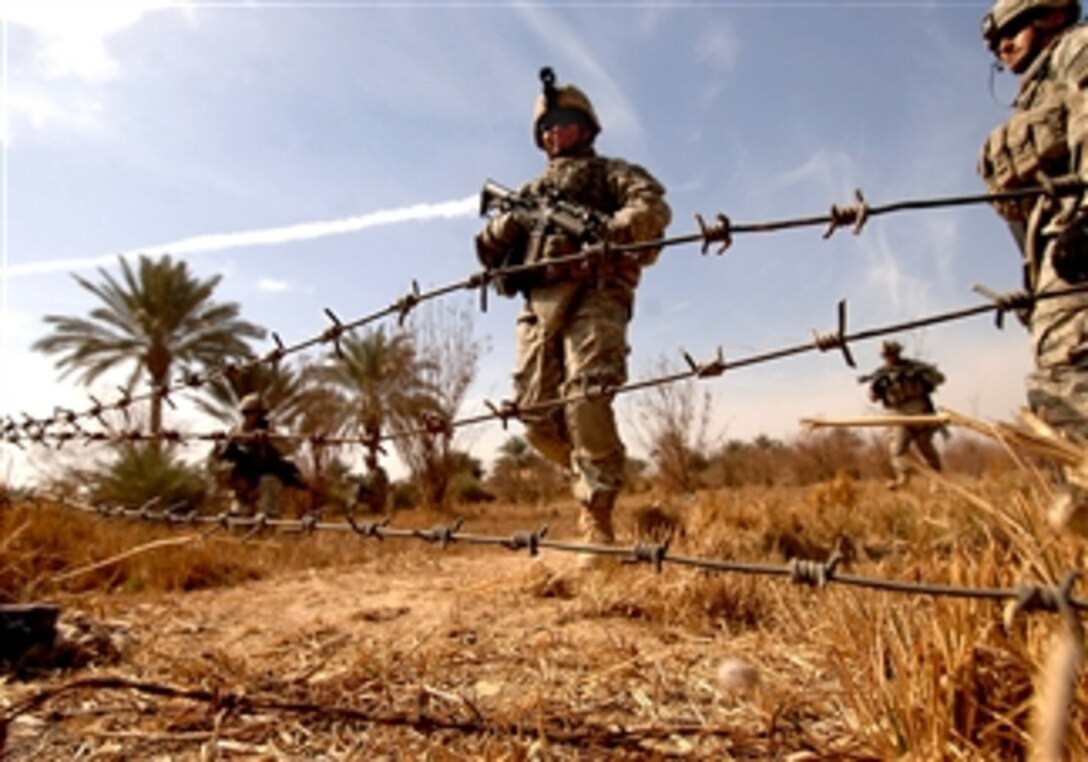 U.S. Army soldiers scan for weapons caches during a clearing operation in Kesra, Iraq, Feb. 24, 2008. The soldiers are assigned to the 3rd Infantry Division 3rd Heavy Brigade Combat Team, 15th Infantry Regiment, 1st Battalion, Bravo Company. 