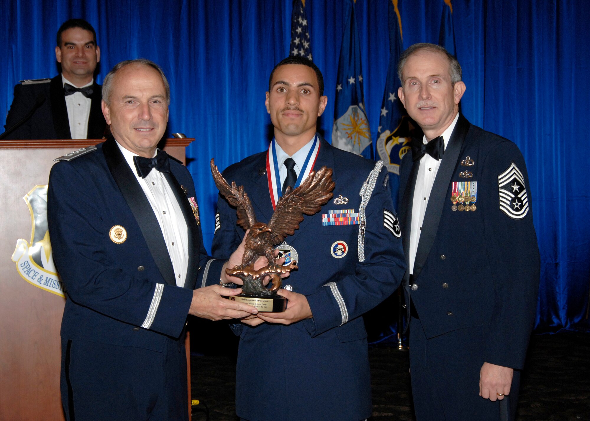 Honor Guard Member of the Year was presented to Staff Sgt Andre Stevens. Also pictured is SMC Commander Lt. Gen.  Michael Hamel and SMC Command Chief Master Sergeant Steven Crocker. (Photo by Lou Hernandez)