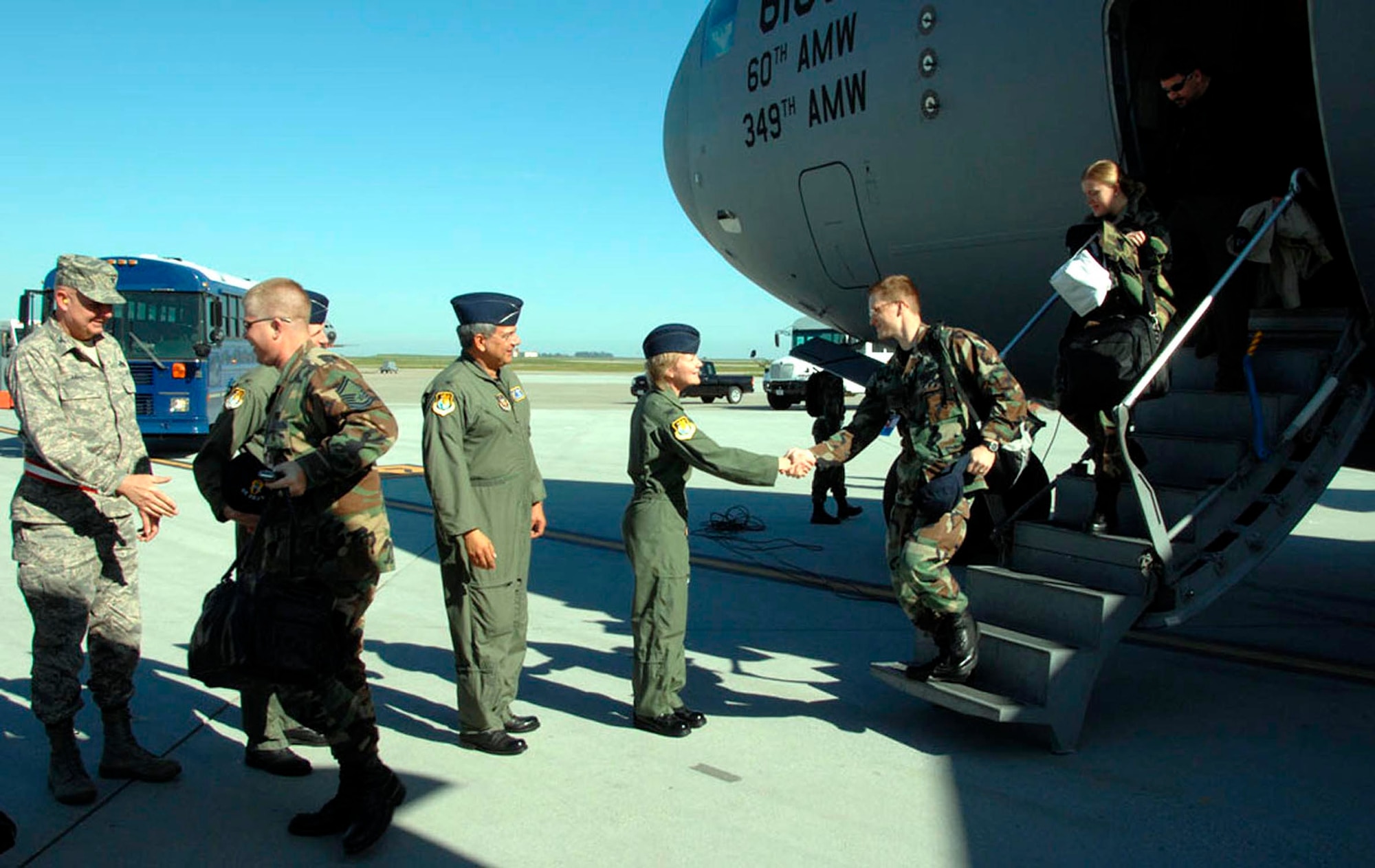 TRAVIS AIR FORCE BASE, Calif., -- The welcome line: Col. Maryanne Miller, commander for the 349th Air Mobility Wing at Travis Air Force Base, Calif., shakes hands with 1st. Lt. Dustin Doyle, Chief of Assignments Branch for the Air Force Reserve Command, Robins AFB, Ga., as he departs a C-17 aircraft, March 3. 
Lieutenant Doyle is part of a 54-member Air Force Reserve Inspector General’s Unit Compliance Inspection team. 
Colonel Miller along with the 349th vice commander and group commanders were welcoming the team to Travis to kick-off a five day UCI inspection of the 349th AMW. 
The team will perform an independent assessment of the health, effectiveness, and performance of the wing with an ultimate goal of optimizing its capabilities as part of our combat air forces. The team helps the wing find and resolve issues, train and mentor personnel, share new ideas and benchmark programs while stressing a “we’re here to help” attitude.
(U.S. Air Force photo/Master Sgt. Wendy Weidenhamer)