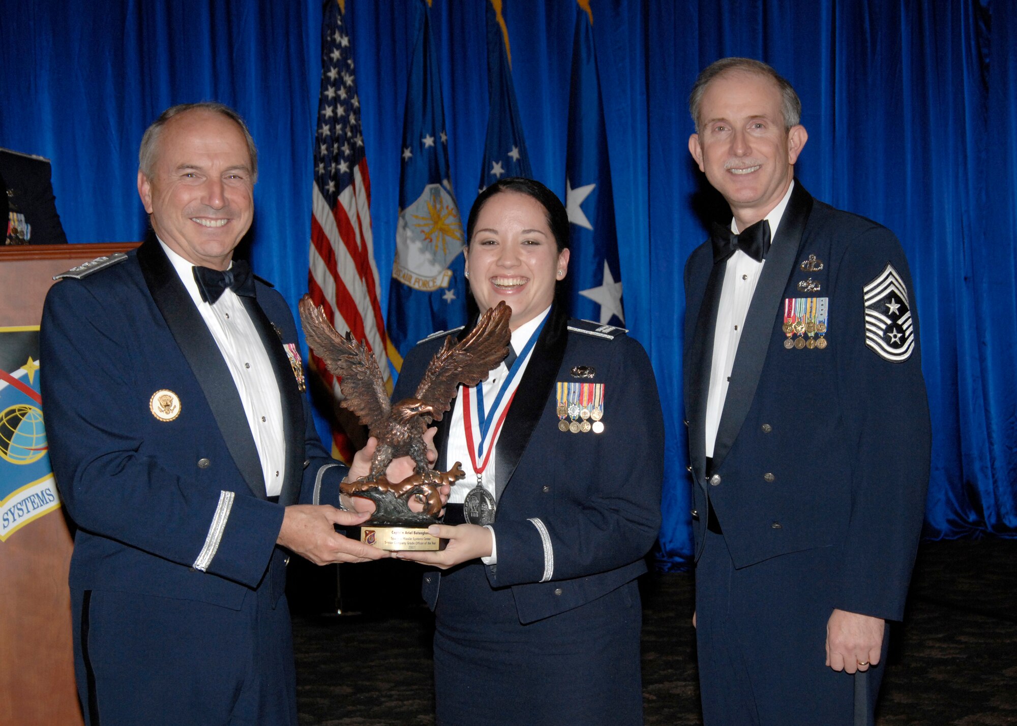 Senior Company Grade Officer of the Year was presented to Capt. Ariel Batungbacal. Also pictured is SMC Commander Lt. Gen.  Michael Hamel and SMC Command Chief Master Sergeant Steven Crocker. (Photo by Lou Hernandez)