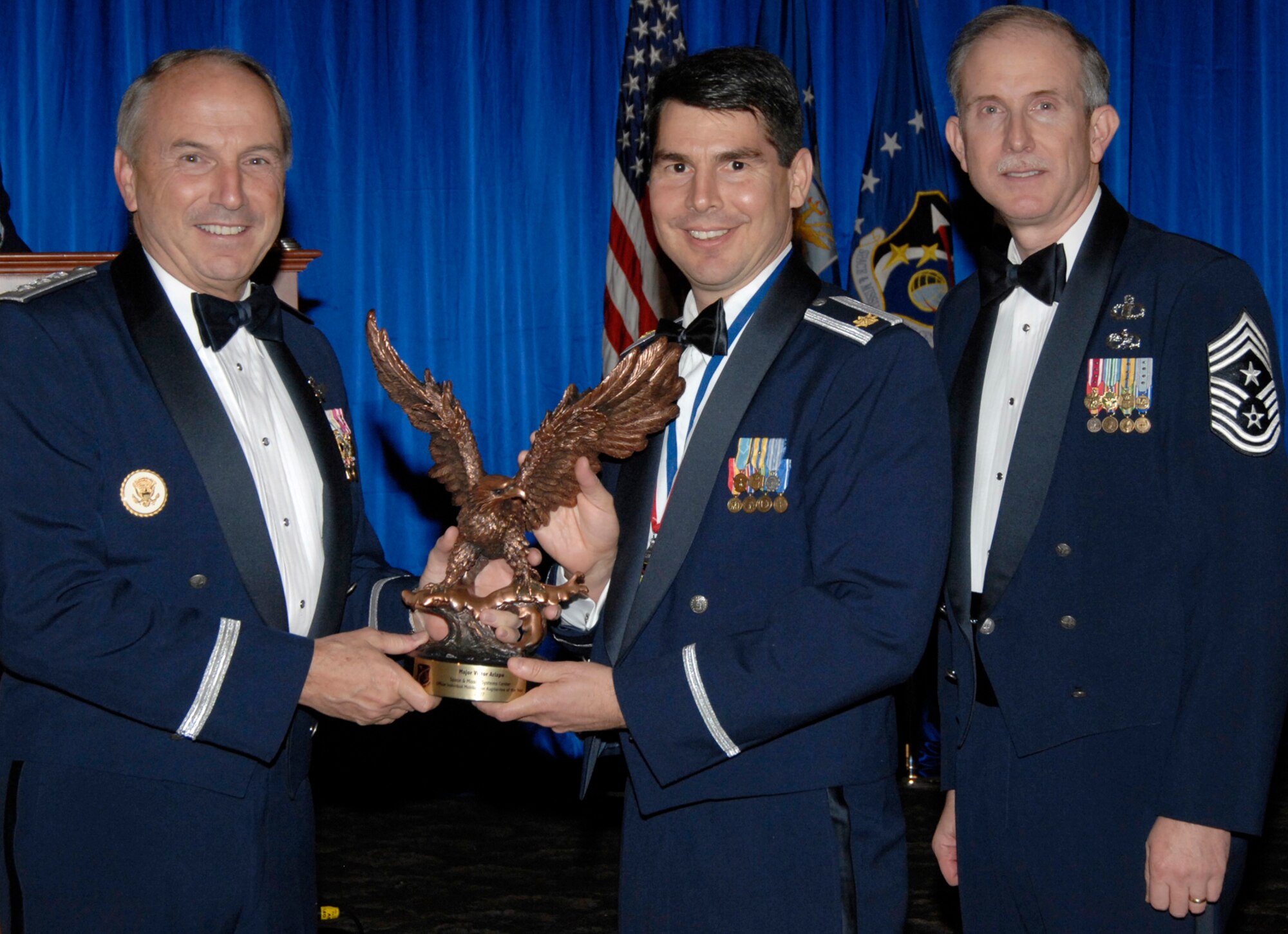 Officer Individual Mobilization Augmentee of the Year was presented to Maj. Victor Arizpe. Also pictured is SMC Commander Lt. Gen.  Michael Hamel and SMC Command Chief Master Sergeant Steven Crocker. (Photo by Lou Hernandez)