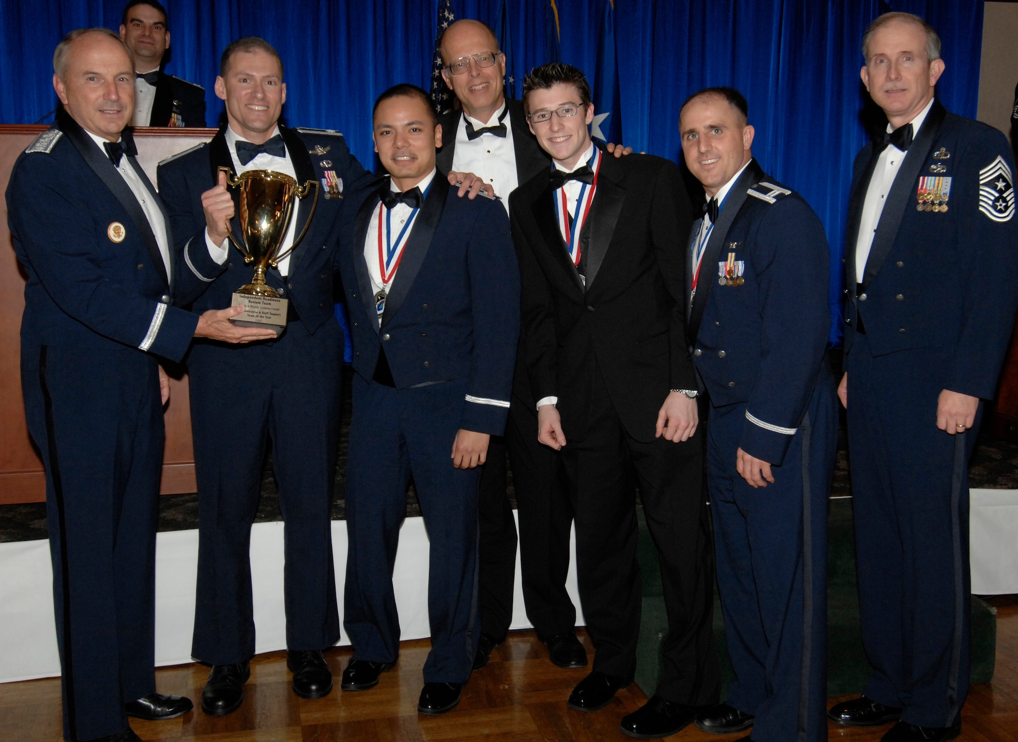 The Staff and Administrative Support Team Award was presented to the Independent Readiness Review Team. Also pictured is SMC Commander Lt. Gen.  Michael Hamel and SMC Command Chief Master Sergeant Steven Crocker. (Photo by Lou Hernandez)