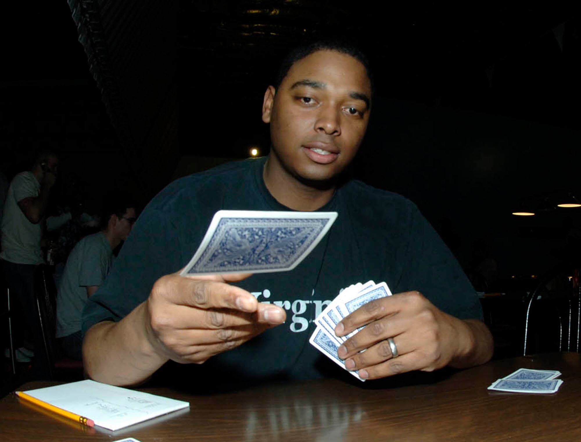 FAIRCHILD AIR FORCE BASE, Wash. – Staff Sgt. William Dunston, 92nd Maintenance Squadron, tosses a card on the table during the spades tournament on Feb. 28. The first sergeants sponsored a skate night at the base skating rink which including skating and dominoes tournament. (U.S. Air Force photo/Staff Sgt. JT May III)
