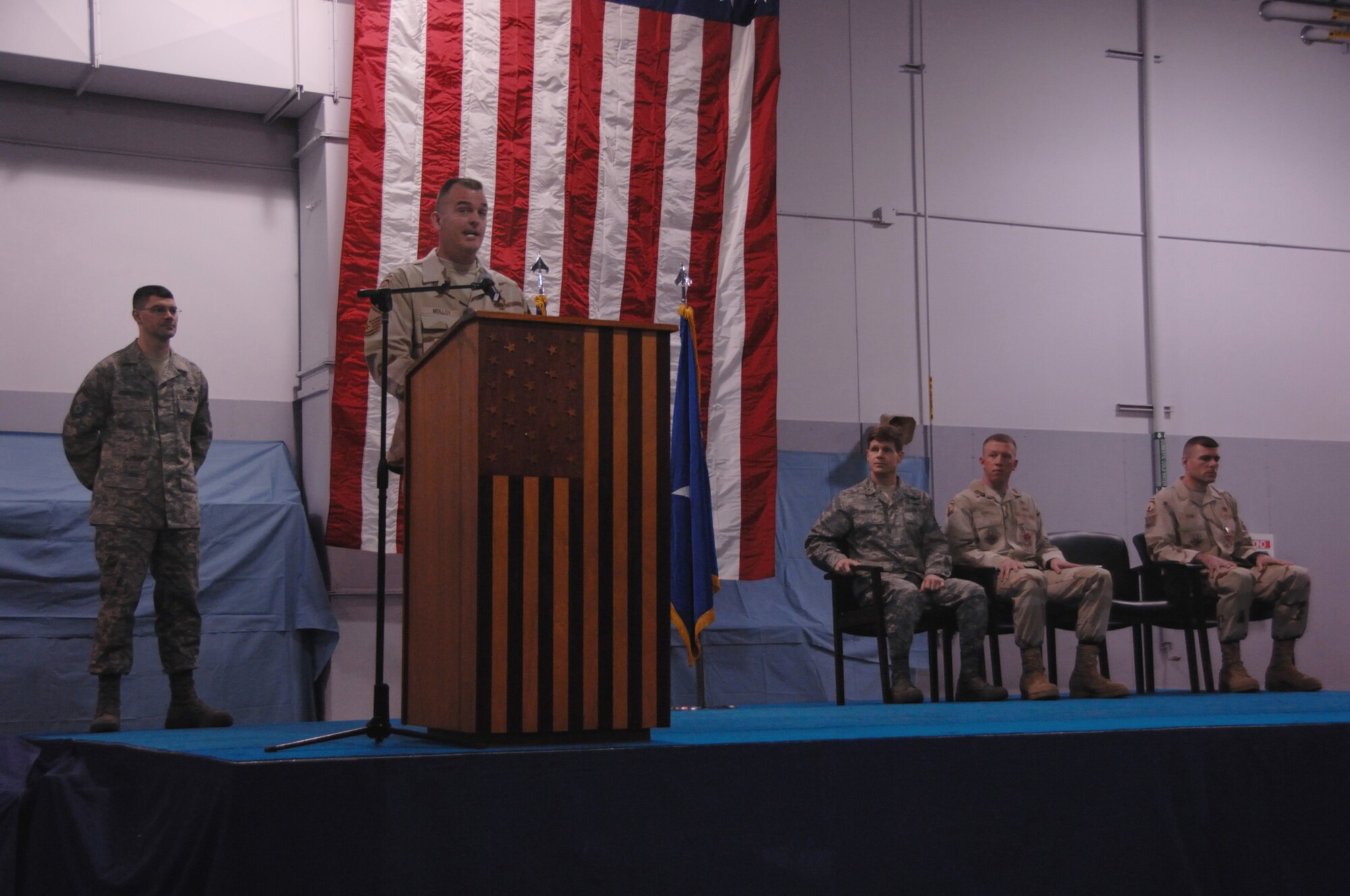 EIELSON AIR FORCE BASE, Alaska --Chief Master Sgt. Eric Molloy, 354th Security Forces Squadron manager, shares his experiences with members of the Iceman Team Feb 29, 2008, at the Joint Mobility Complex. A homecoming was held to recognize all of Eielson's Airmen who returned from deployments overseas. (U.S. Air Force photo/Airman 1st Class Christopher Griffin)
