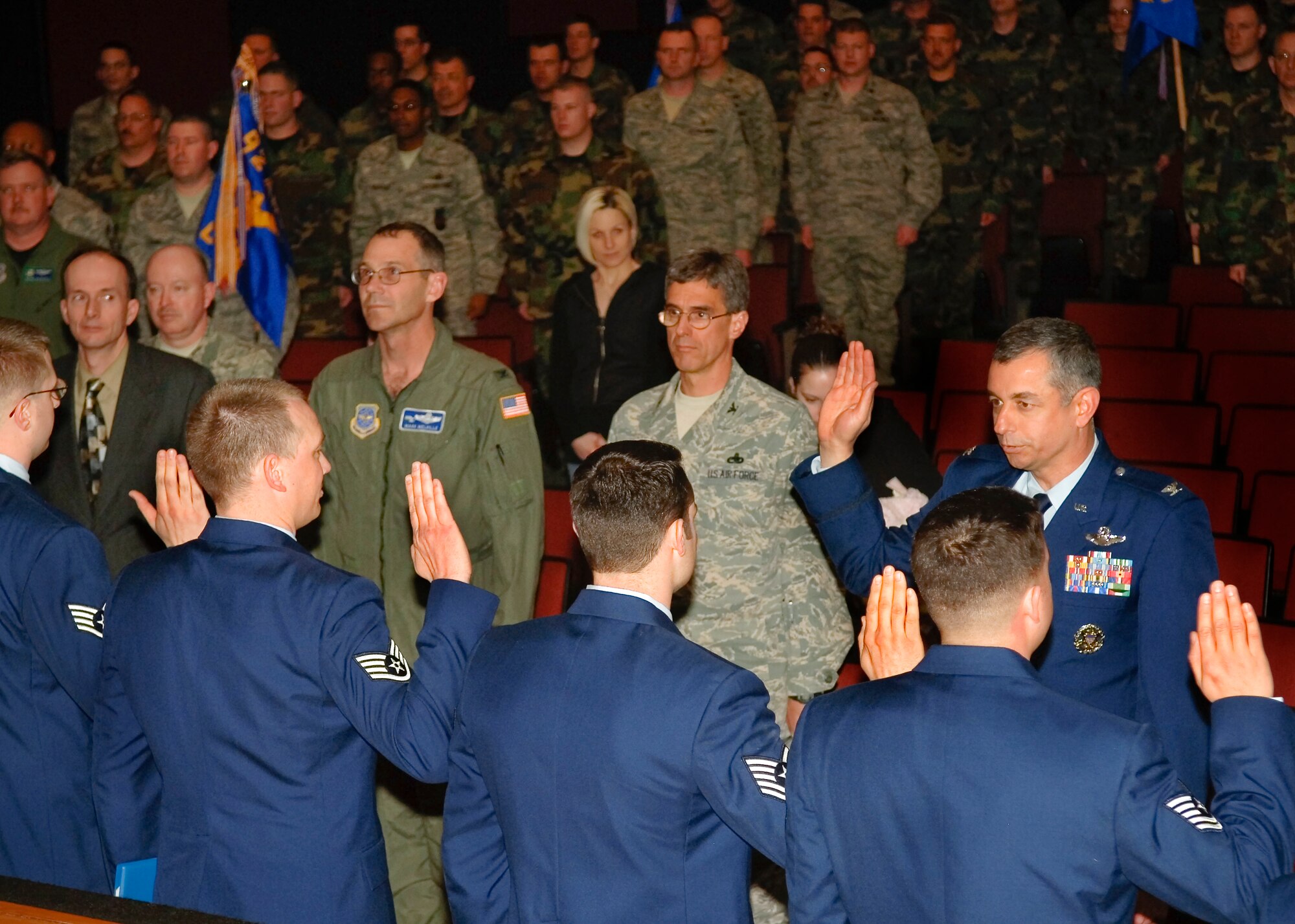 FAIRCHILD AIR FORCE BASE, Wash. – Col. Roger Watkins, 92nd Air Refueling Wing acting commander, swears in Airman recognized at the Wing Promotion Ceremony Feb. 29 at the base theater. (U.S. Air Force photo / Airman 1st Class Joshua Chapman) 