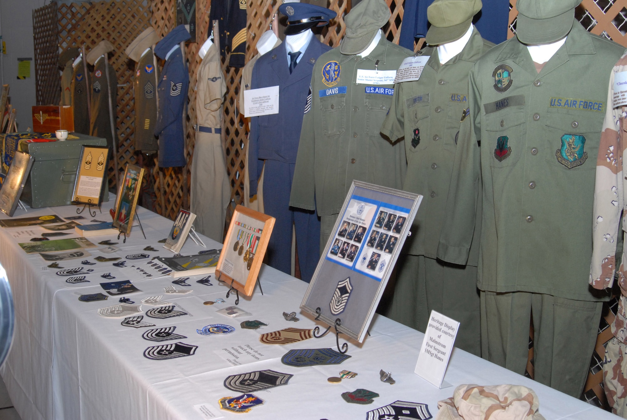 The decorations at the Malmstrom Air Force Base 60th Anniversary Air Force Ball celebrate “Heritage to Horizons” with a display of Army and Air Force memorabilia Sept. 15, 2007, features the private collection from Chief Master Sgt. Jerry Hanes, 341st Operations Group interim-superintendent. Chief Hanes regularly sets up historical displays at local events to showcase his extensive military memorabilia collection ranging from pre-Civil War to present featuring uniforms, patches, collar brass, framed photos and documents to name a few. He has been collecting for 35 years and enjoys educating people on the history of the military. (U.S. Air Force photo/John Turner)