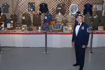 Then Senior Master Sgt. Jerry Hanes stands before his extensive Army Air Corps and Air Force memorabilia at the Malmstrom Air Force Base 60th Anniversary Air Force Ball Sept. 15, 2007. His collection ranges from pre-Civil War to present and he collects uniforms, patches, collar brass, framed photos and documents to name a few. His passion for collecting military history has spanned more than 35 years. (U.S. Air Force photo/John Turner)