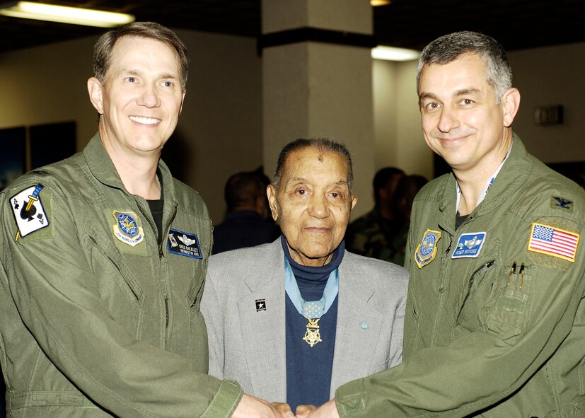 FAIRCHILD AIR FORCE BASE, Wash.—Col. Greg Bulkley, 141st Air Refueling Wing commander, and Col. Roger Watkins, 92nd Air Refueling Wing commander, welcome Medal of Honor recipient 1st Lt. (Ret.) Vernon Baker to Club Fairchild on Feb. 28. Multiculturalism in the Armed Forces was celebrated over a soul food buffet. (Air Force photo/ Airmen 1st Class Melissa Barnett)