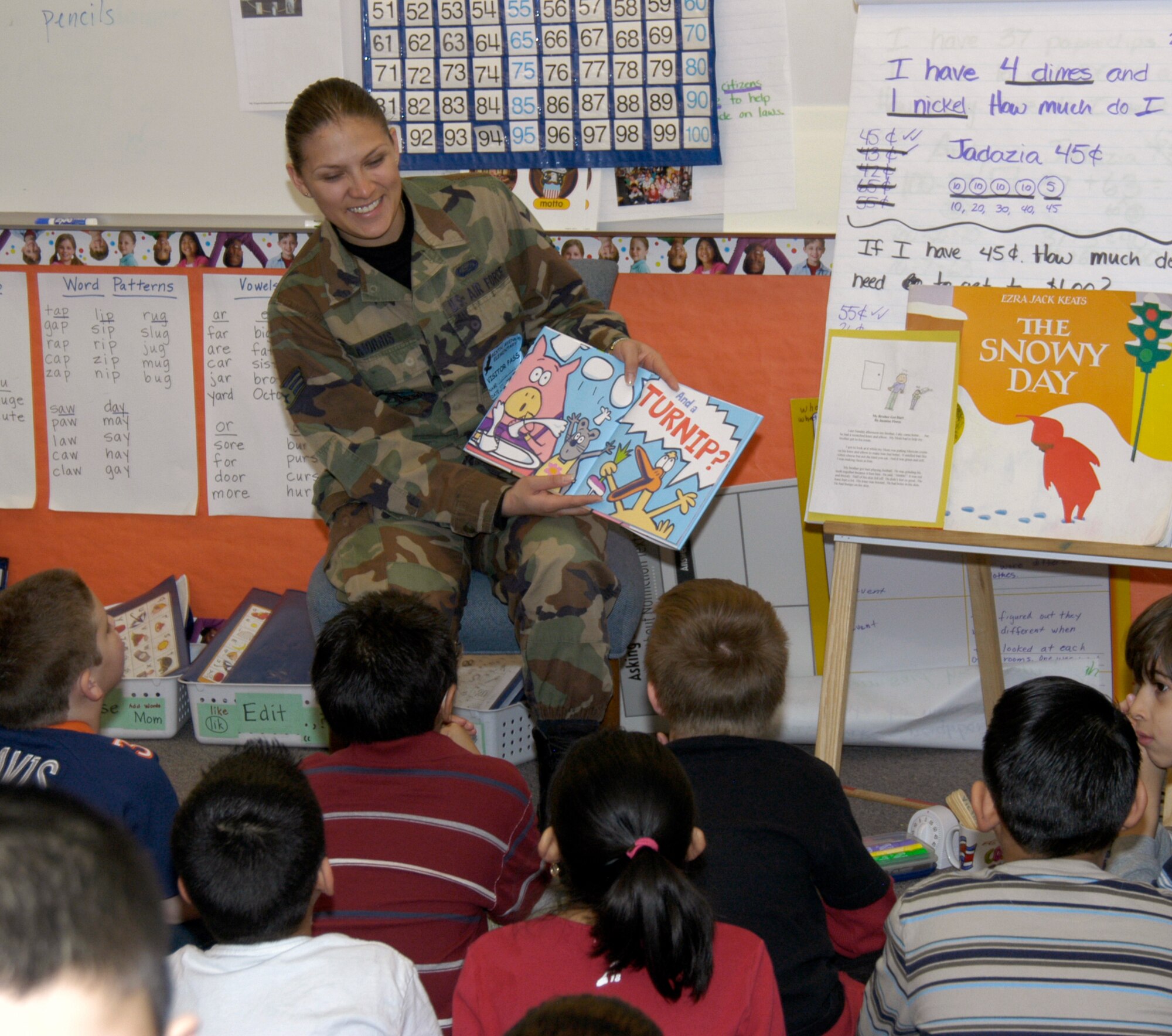 Senior Airman Marisa Morris, DPS, reads to second graders at Sixth Avenue Elementary in Aurora, Colo. Twenty-five volunteers from the Air Reserve Personnel Center participated in the National Education Association's Read Across America program March 3. The annual event is designed to motivate and teach children about the importance of reading. The event began in 1998 and has been held every year on or around the birthday of children's book author Dr. Seuss. (U.S. Air Force photo/Mike Molina) 
