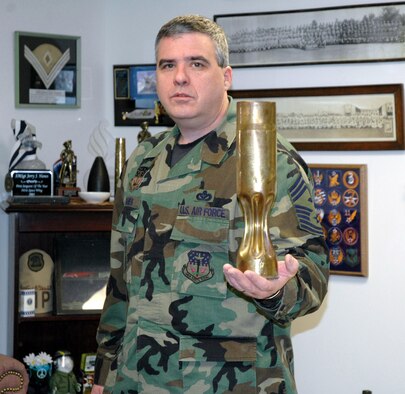 Chief Master Sgt. Jerry Hanes, 341st Operations Group interim-superintendent, displays trench art from World War I. During the “Great War” soldiers sitting in trenches sculpted, molded and chiseled away on 75 mm artillery shell casings and made what is called, “trench art.” Chief Hanes has his trench art displayed in his office which has a finely sculpted eagle insignia on it. It was his wife’s great-grandfathers who made it during WWI. (U.S. Air Force photo/Senior Airman Eydie Sakura)