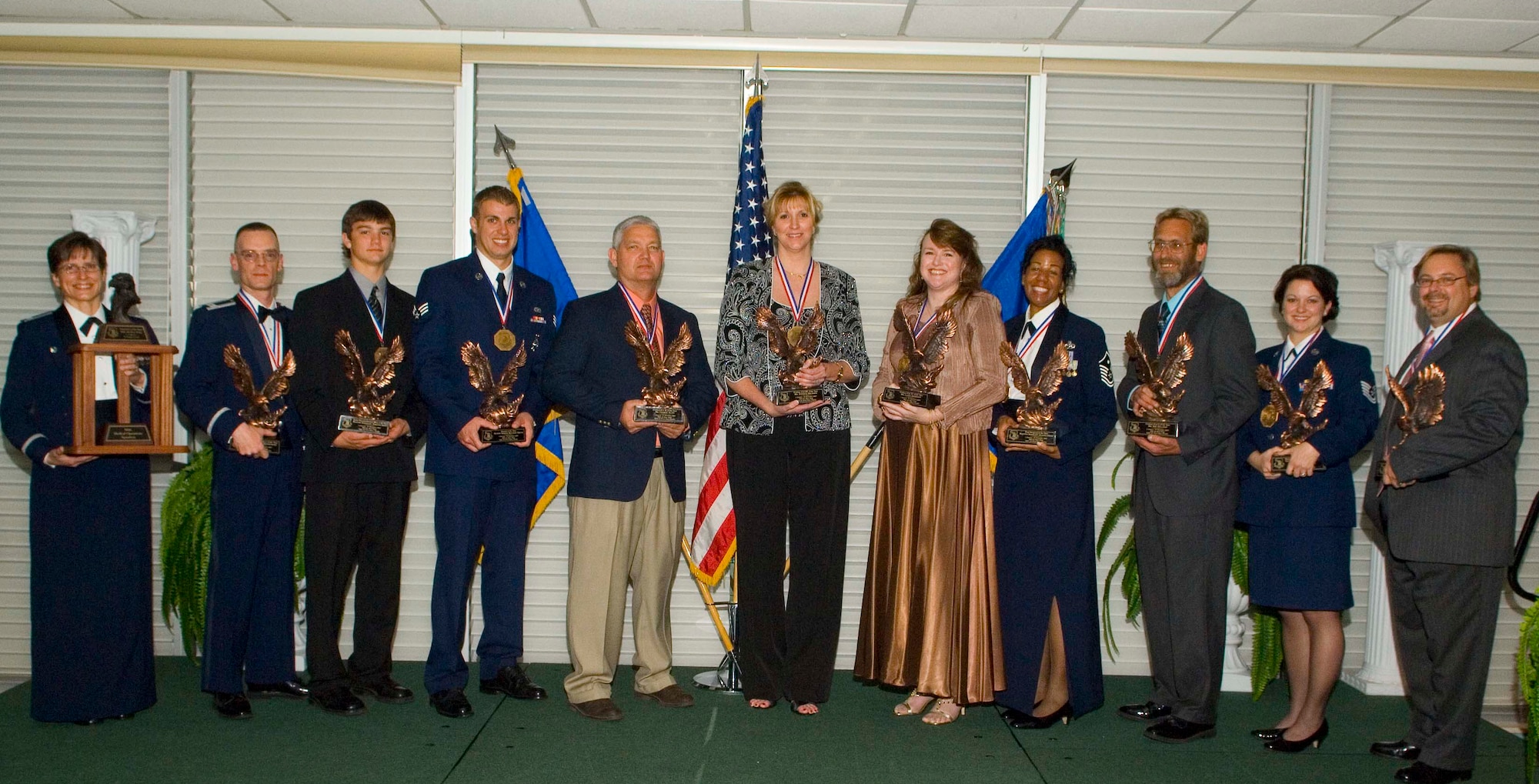 Winners display their trophies at the 96th Air Base Wing annual banquet and awards ceremony. The ceremony was held at the Officers' Club on Feb. 29