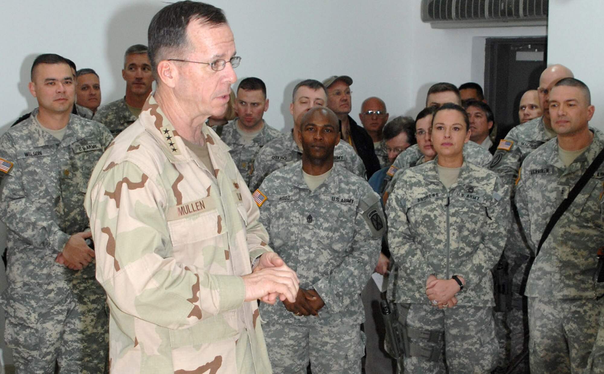 Chairman of the Joint Chiefs of Staff Navy Adm. Mike Mullen address Soldiers and Airmen during his March 2 visit to Kirkuk Air Base, Iraq. The highest ranking military officer attended meetings with the State Department Provincial Reconstruction Team, presided over a short promotion ceremony for two Army officers and had dinner with several Airmen and Soldiers during his visit. (U.S. Air Force photo/Senior Master Sgt. Don Senger) 
