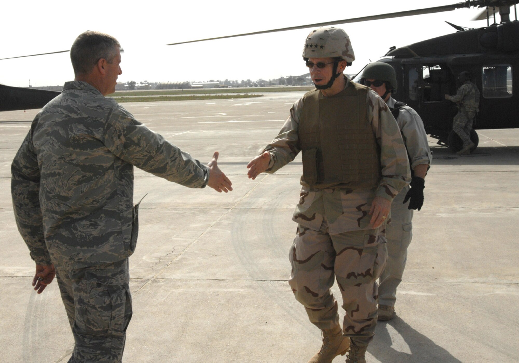 Col. Timothy Strawther greets Chairman of the Joint Chiefs of Staff Navy Adm. Mike Mullen upon arrival during his March 2 visit to Kirkuk Air Base, Iraq. The highest ranking military officer attended meetings with the State Department Provincial Reconstruction Team, presided over a short promotion ceremony for two Army officers and had dinner with several Airmen and Soldiers during his visit. Colonel Strawther is the 506th Air Expeditionary Group commander. (U.S. Air Force photo/Senior Master Sgt. Don Senger)
