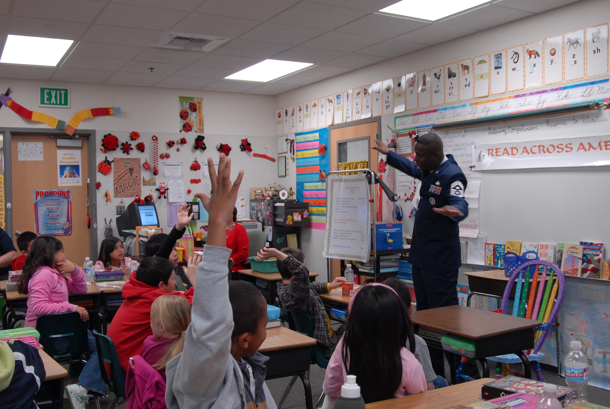 Chief Master Sgt. Juan Lewis, 95th Air Base Wing command chief, speaks to Barrel Springs Elementary School students about miitary life during Read Across America Day March 3. Read Across America is celebrated each year on the first Monday in March to celebrate the birthday of Theodore Geisel, better known as Dr. Seuss. (Air Force photo by Airman 1st Class Stacy Sanchez)