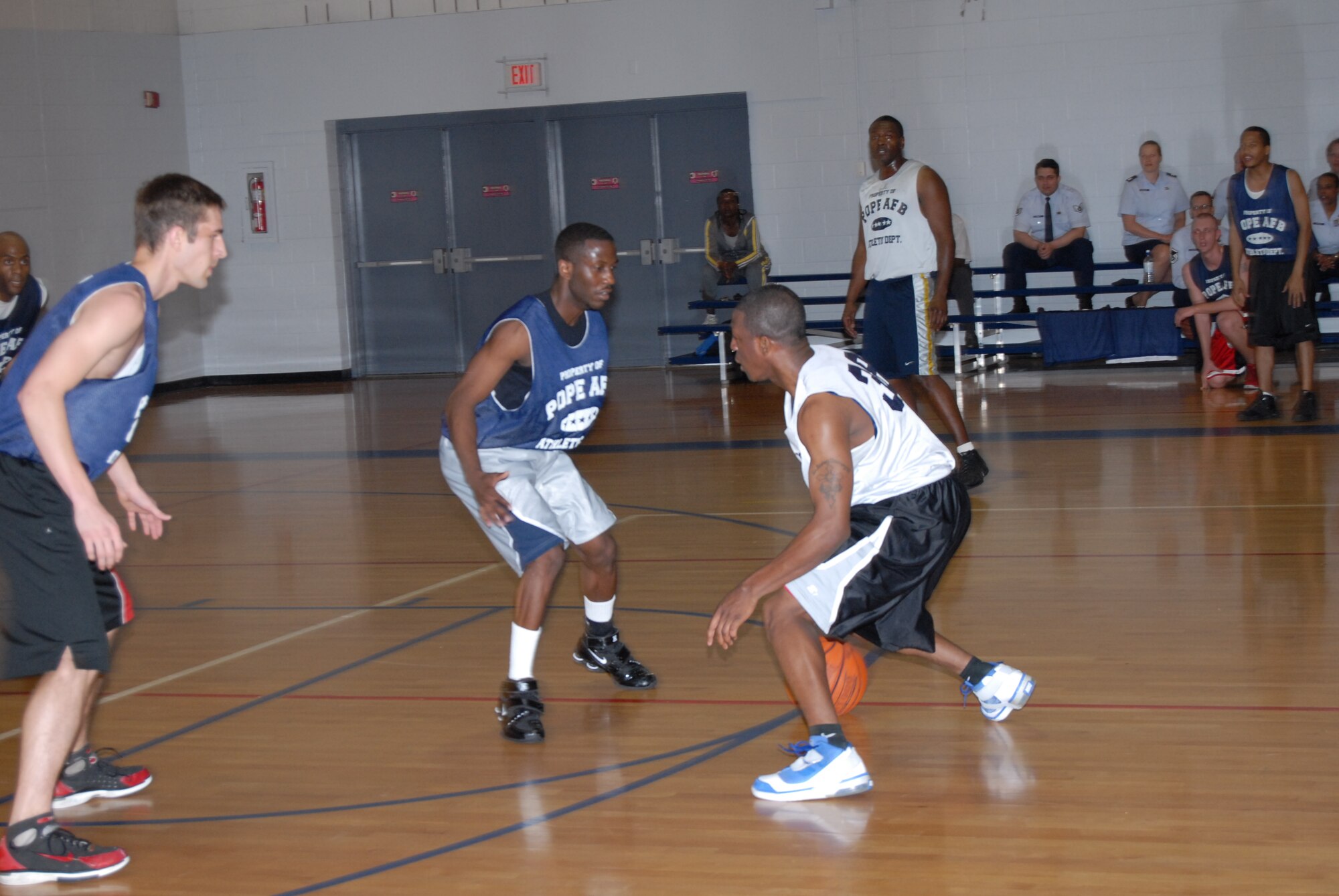 Robert Naylor, 43rd Logistics Readiness Squadron, tries to dribble around Irvin Gourdine, 43rd Mission Support Squadron, during the championship game March 3. (U.S. Air Force Photo by 2nd Lt. Chris Hoyler)