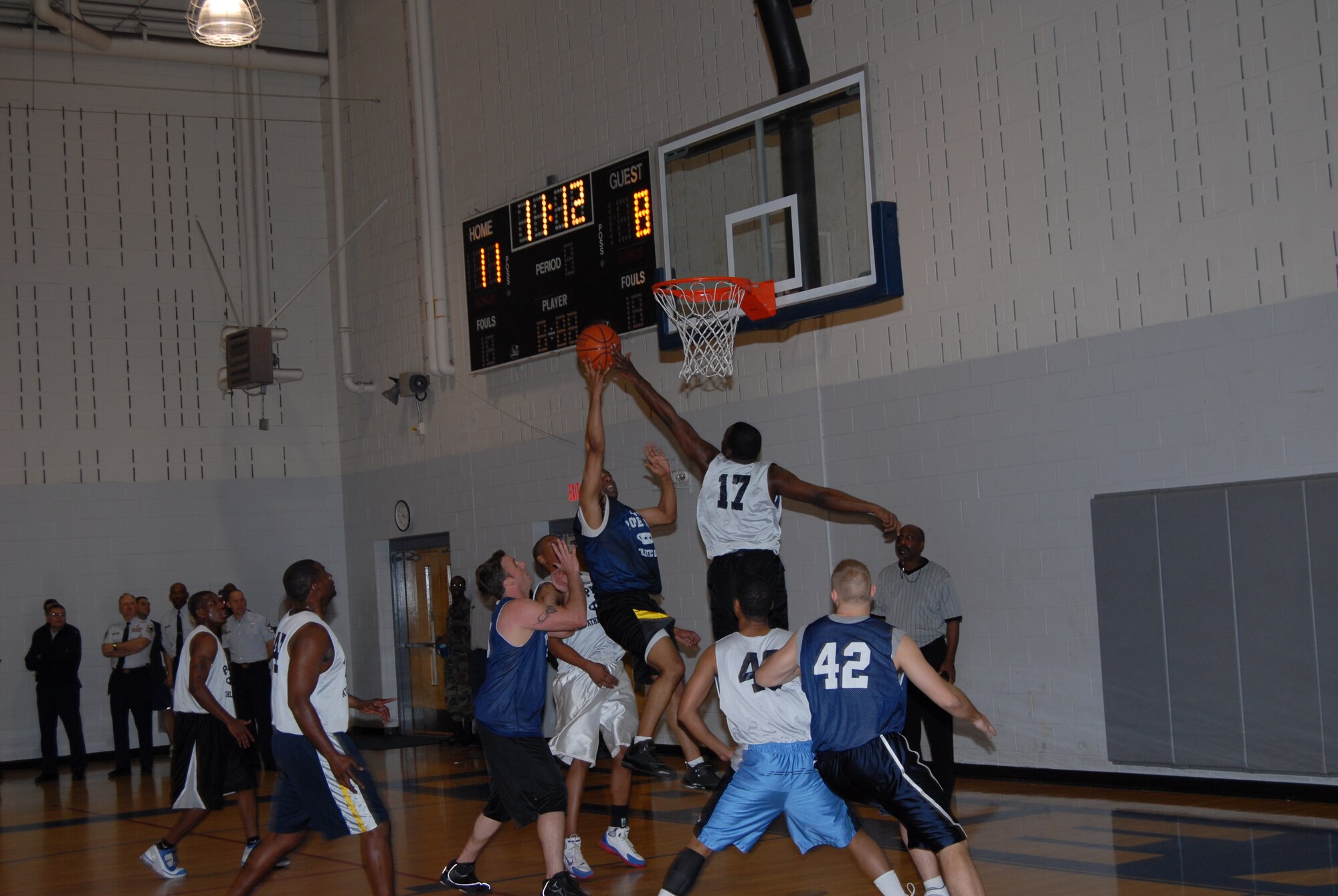 David Bremmer, 43rd Mission Support Squadron, goes up for a layup over Dedrick Robinson, 43rd Logistics Readiness Squadron, during the championship game March 3. (U.S. Air Force Photo by 2nd Lt. Chris Hoyler)